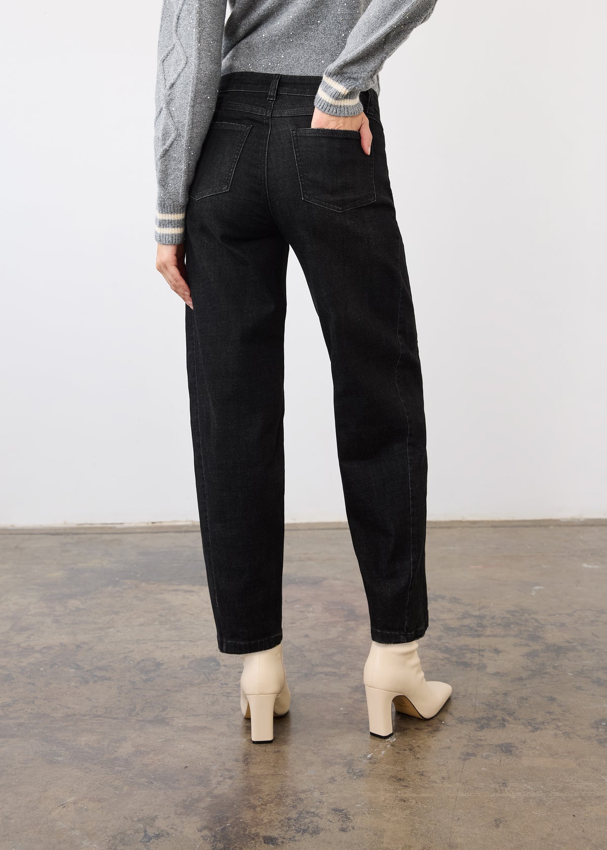 Back view of black denim showcasing patch pockets and relaxed fit by French Dressing Jeans (FDJ)