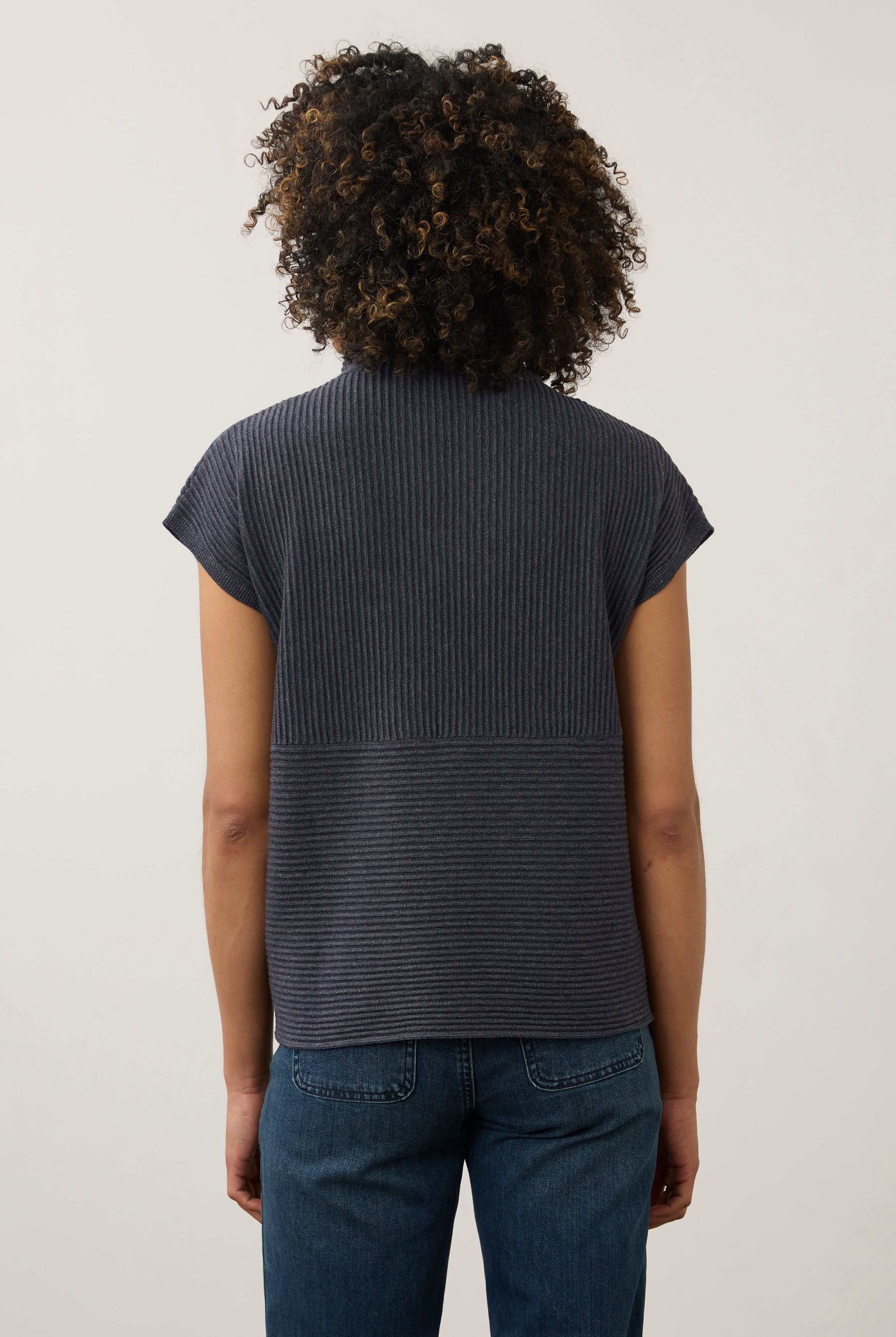 Back view of navy ribbed top with high collar and seamless design by French Dressing Jeans (FDJ)