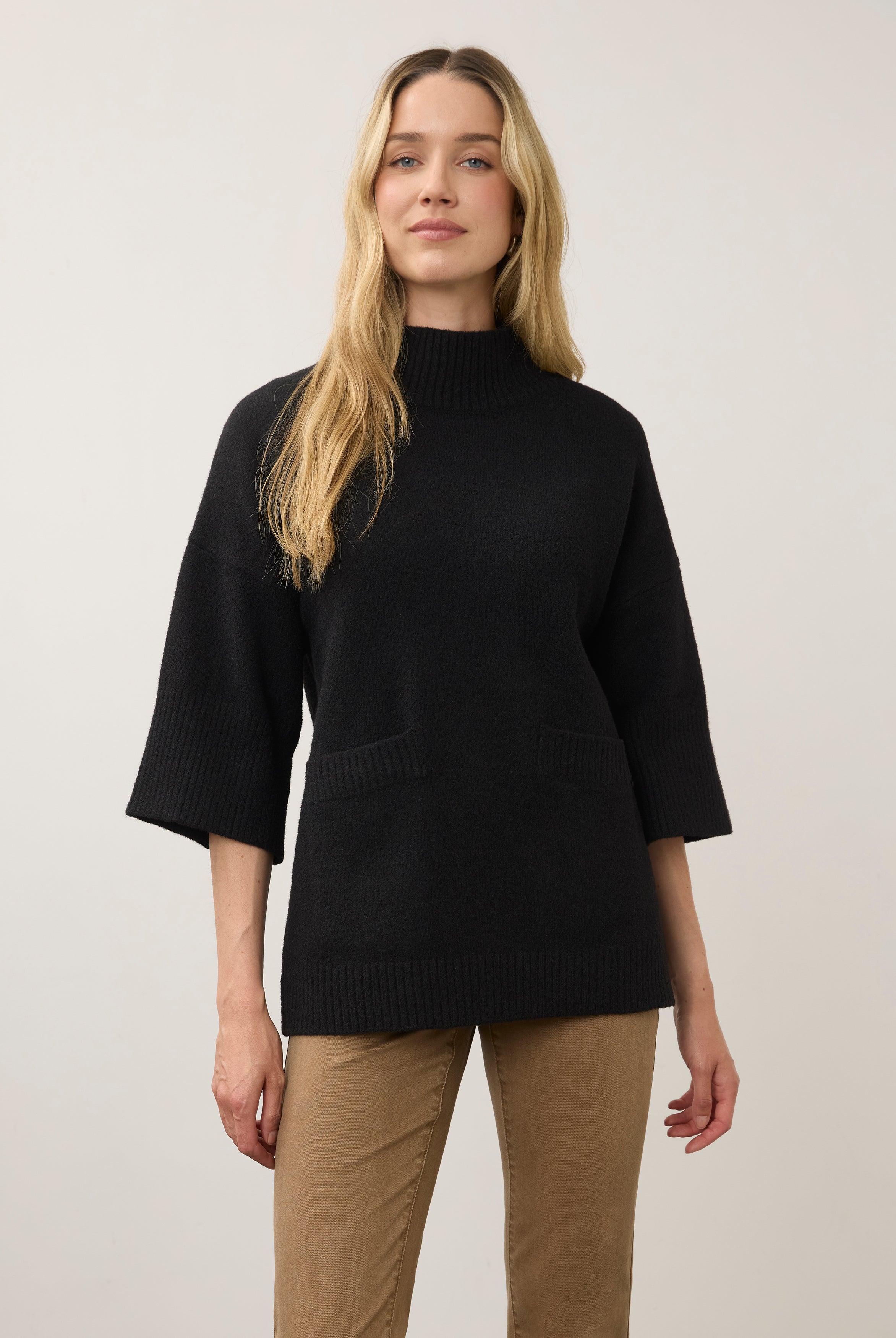 Front view of black tunic sweater with wide sleeves and front pockets by French Dressing Jeans (FDJ)