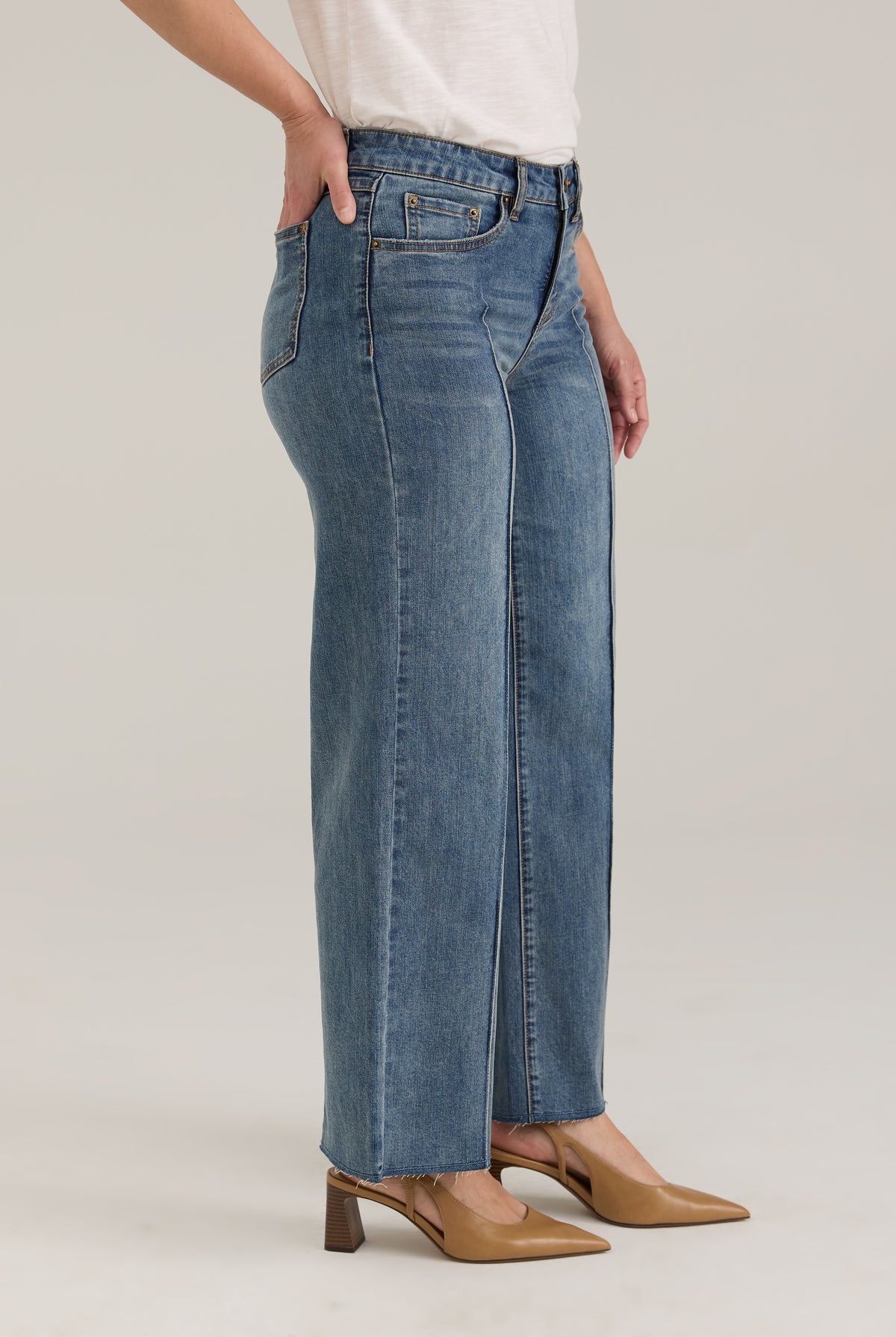 Side profile of Olivia denim in light wash highlighting wide ankle and mid-rise waist by French Dressing Jeans (FDJ)