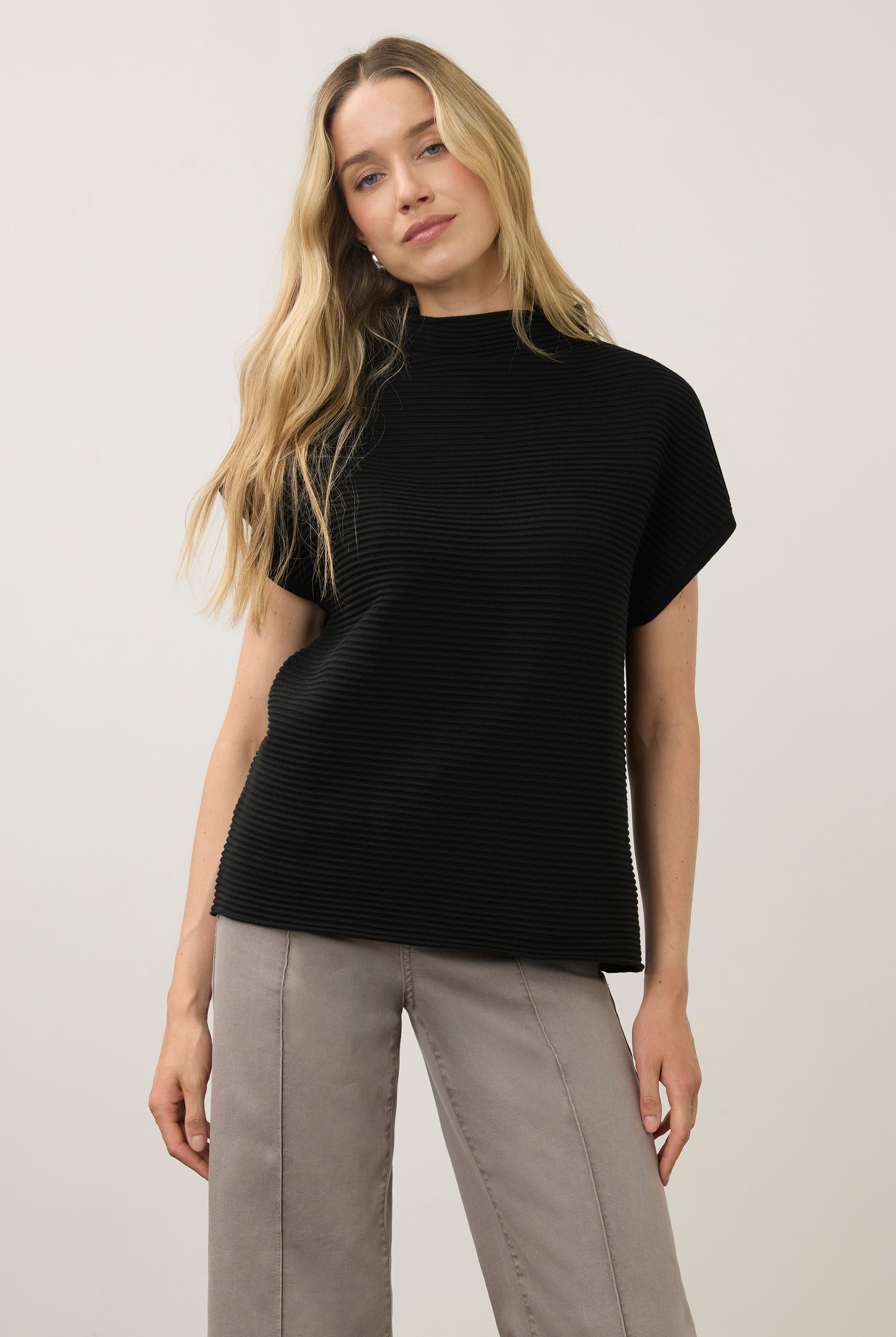 Front view of black short sleeve top with ribbed texture and high collar by French Dressing Jeans (FDJ)