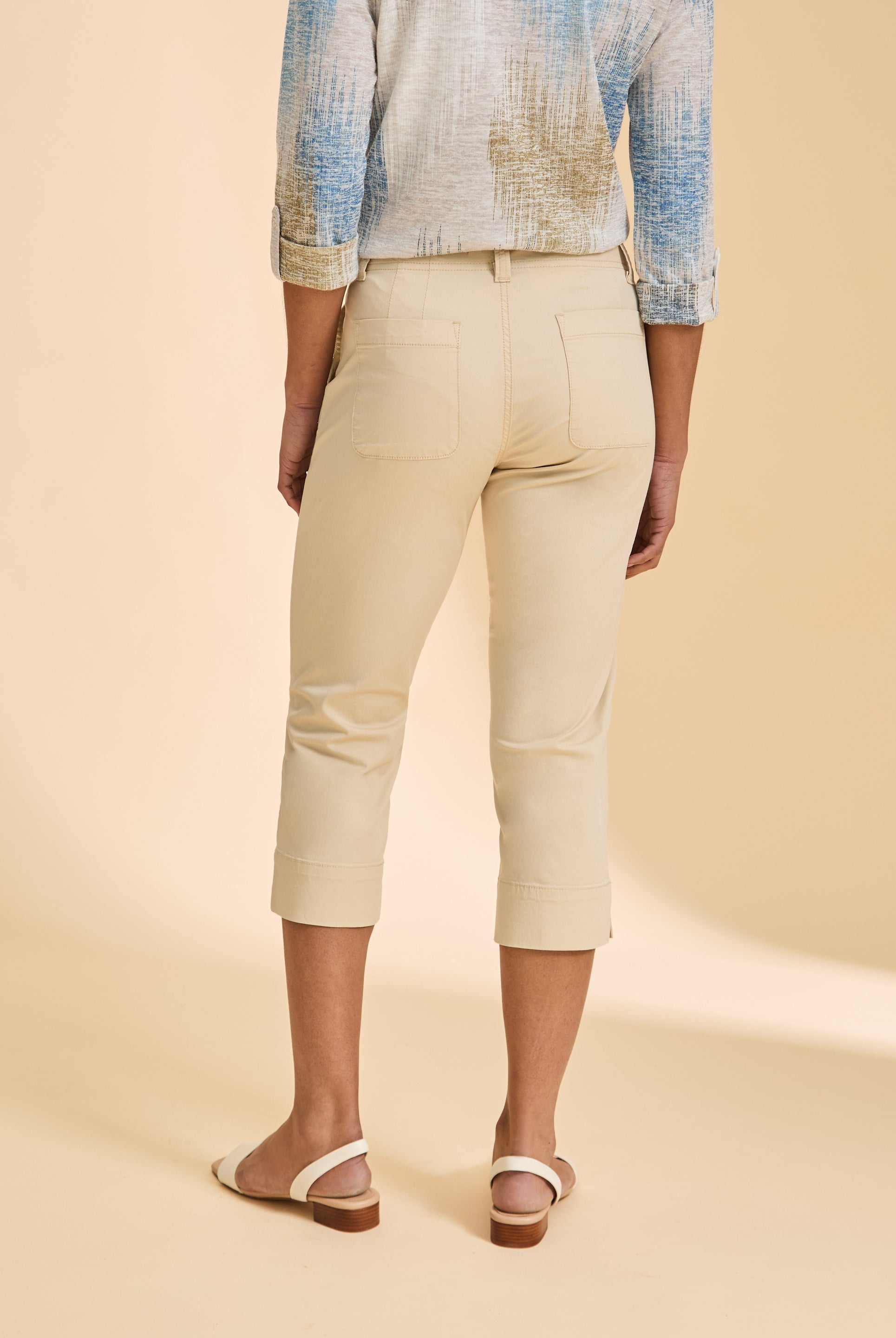 Back view of cream crop pants with patch pockets and slim silhouette by French Dressing Jeans (FDJ)