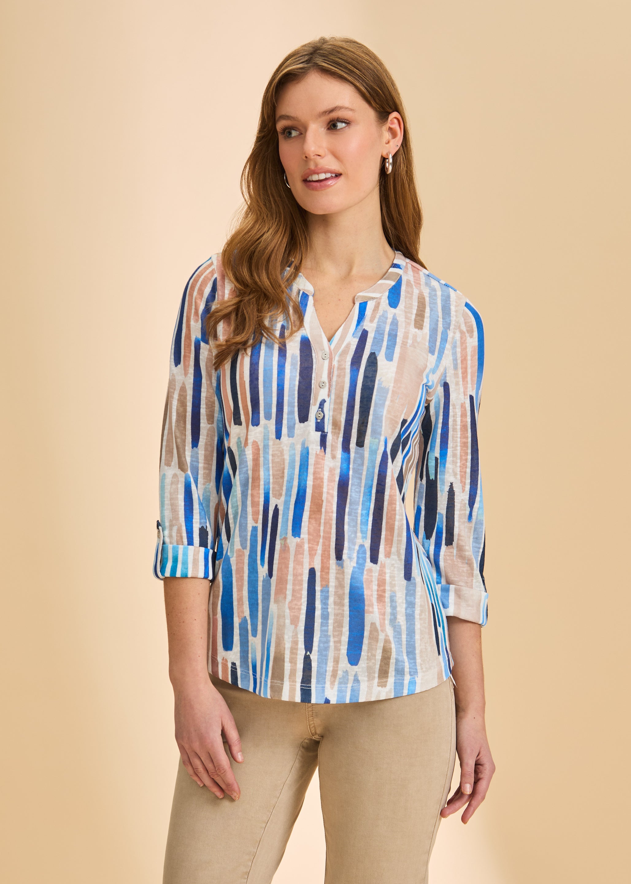 Front view of blue-toned 3/4 sleeve Henley top with buttoned V-neck and colorful stripes by French Dressing Jeans (FDJ)