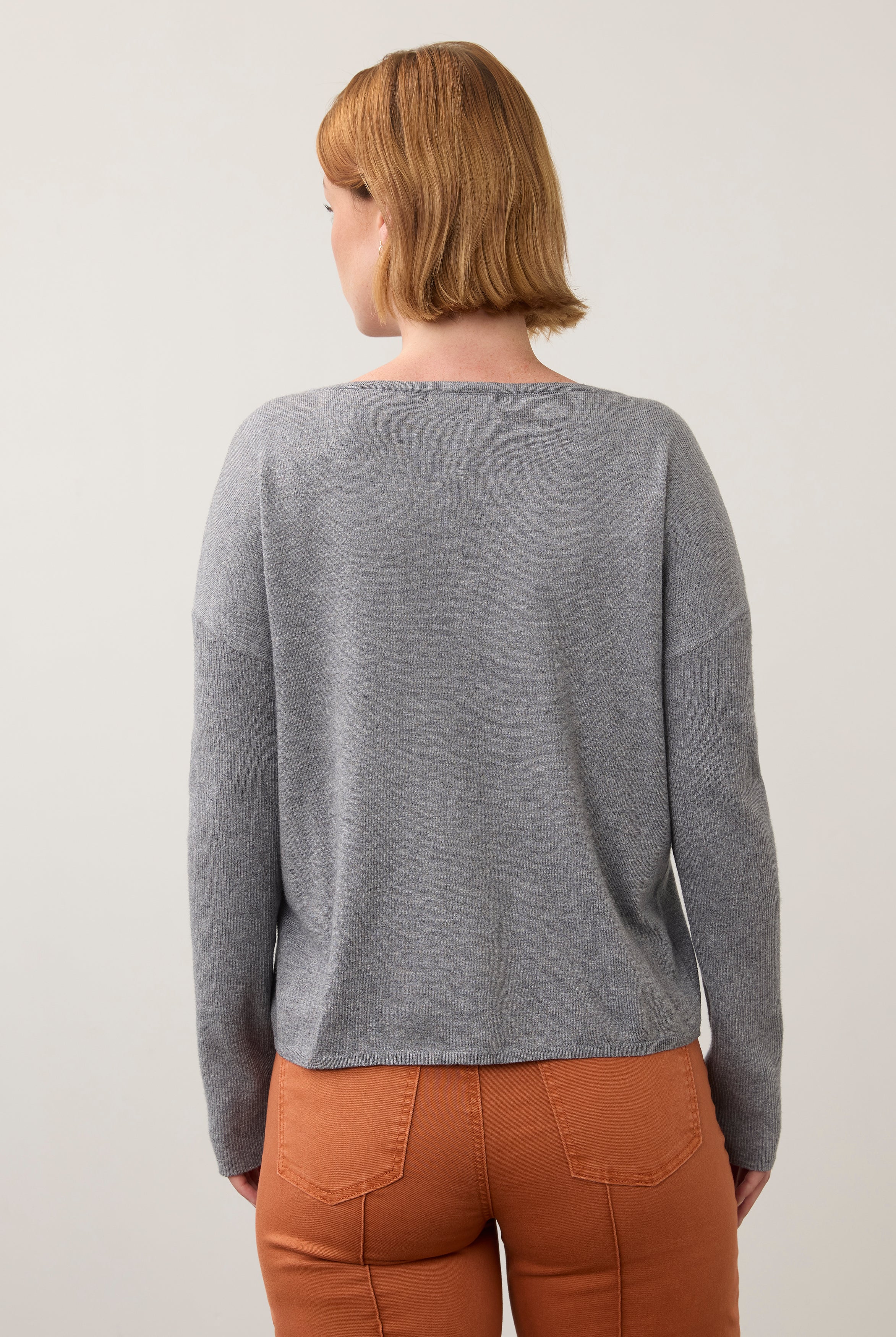 Back view of grey sweater highlighting relaxed fit by French Dressing Jeans (FDJ)