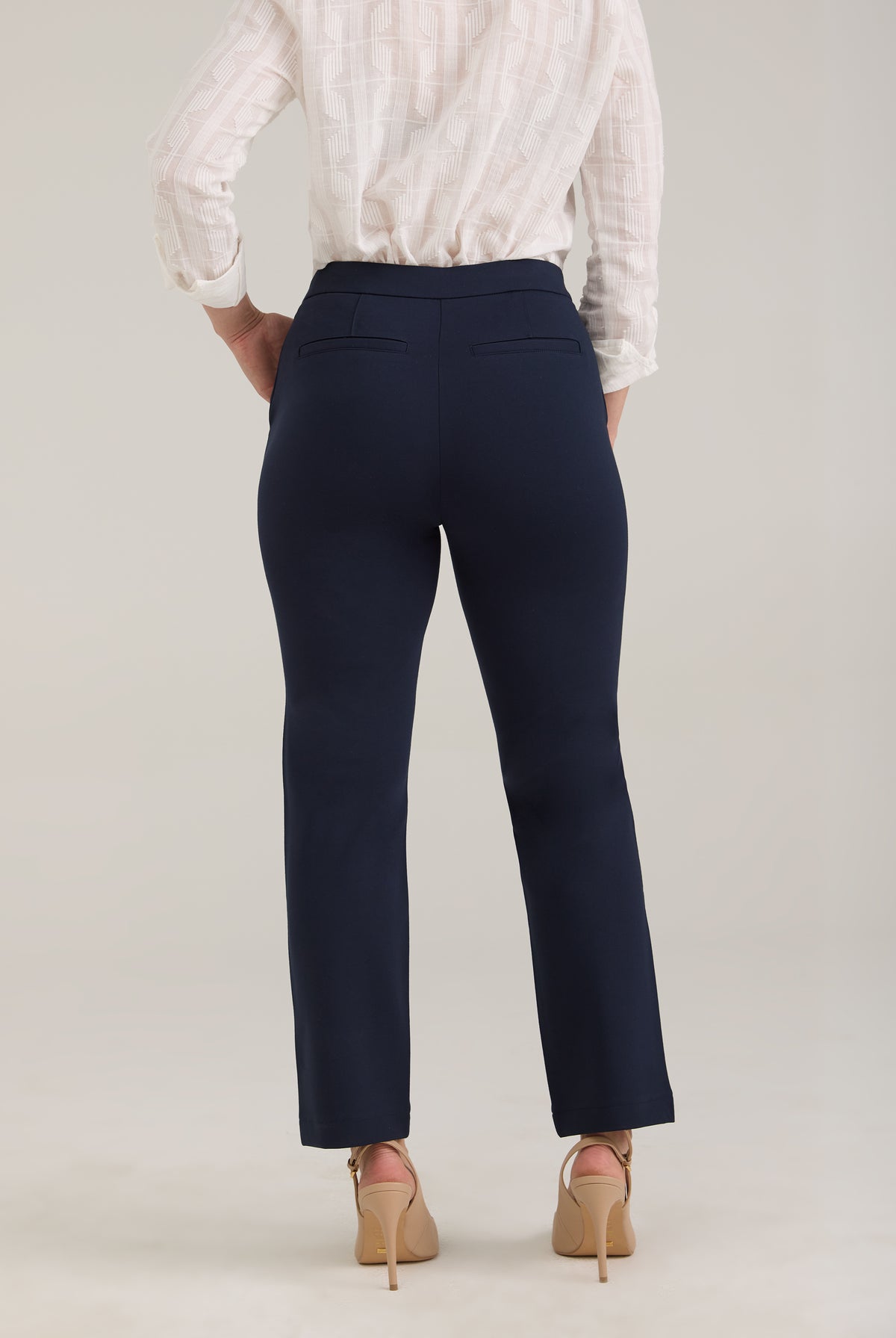 Back view of navy ankle pants featuring fake back welt pockets by French Dressing Jeans (FDJ)