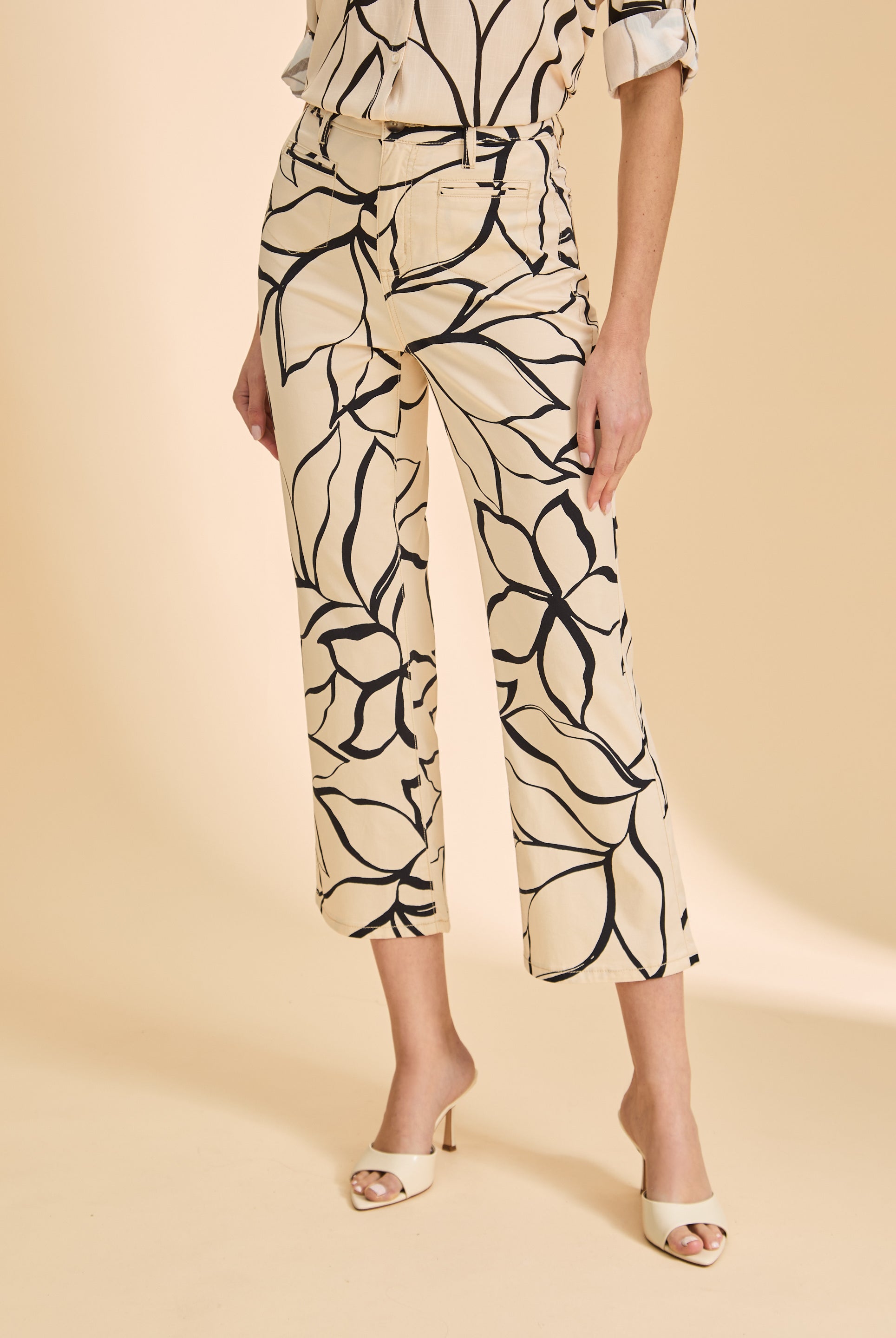 Close-up of beige plumeria crop pants highlighting floral pattern and high-rise waist by French Dressing Jeans (FDJ)