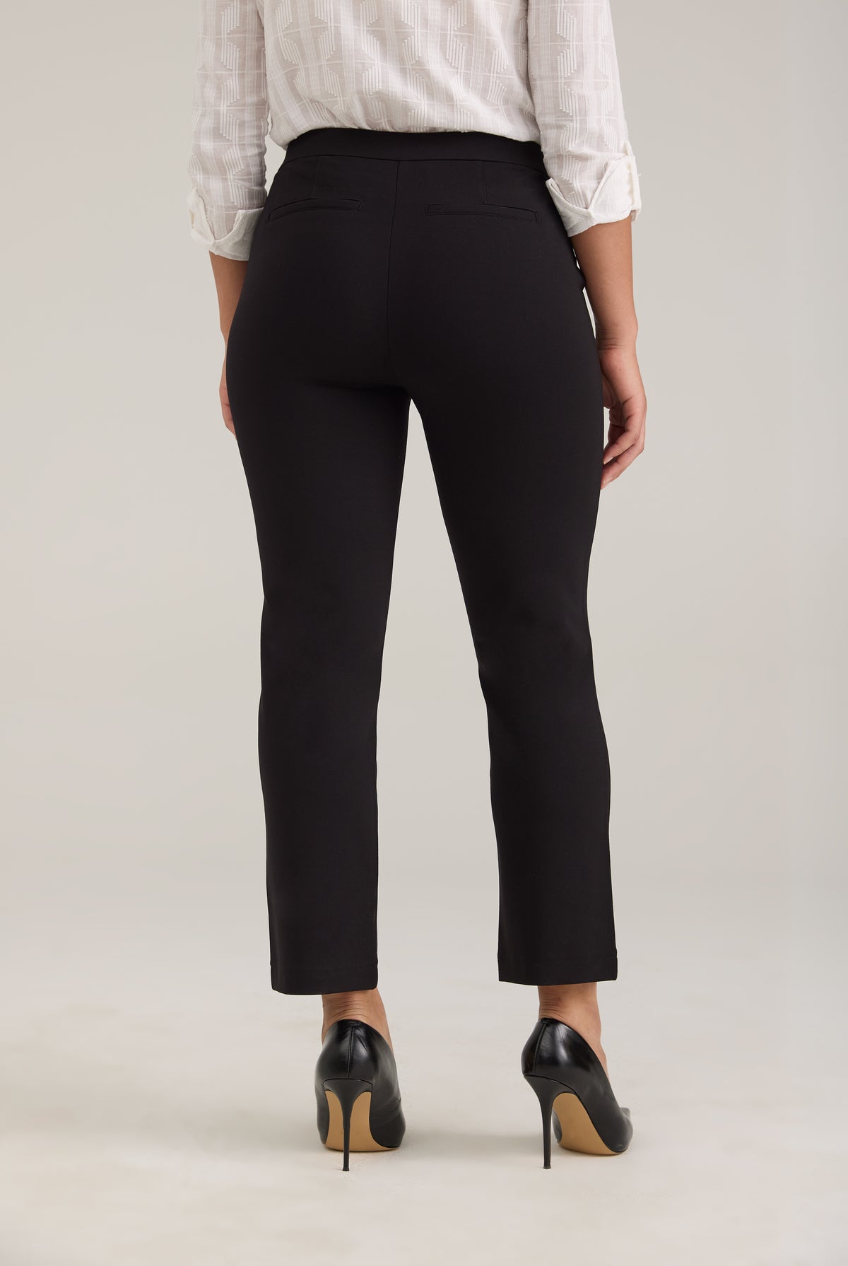 Back view of black ankle pants featuring fake back welt pockets by French Dressing Jeans (FDJ)