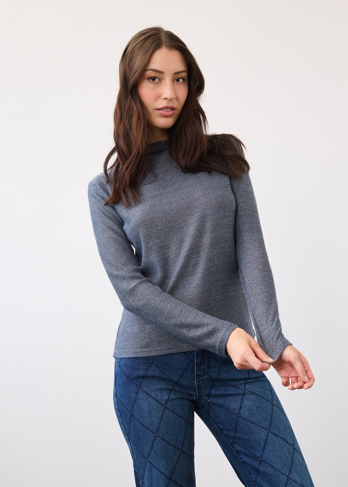 Front view of blue shimmer top with long sleeves and fitted shape by French Dressing Jeans (FDJ)