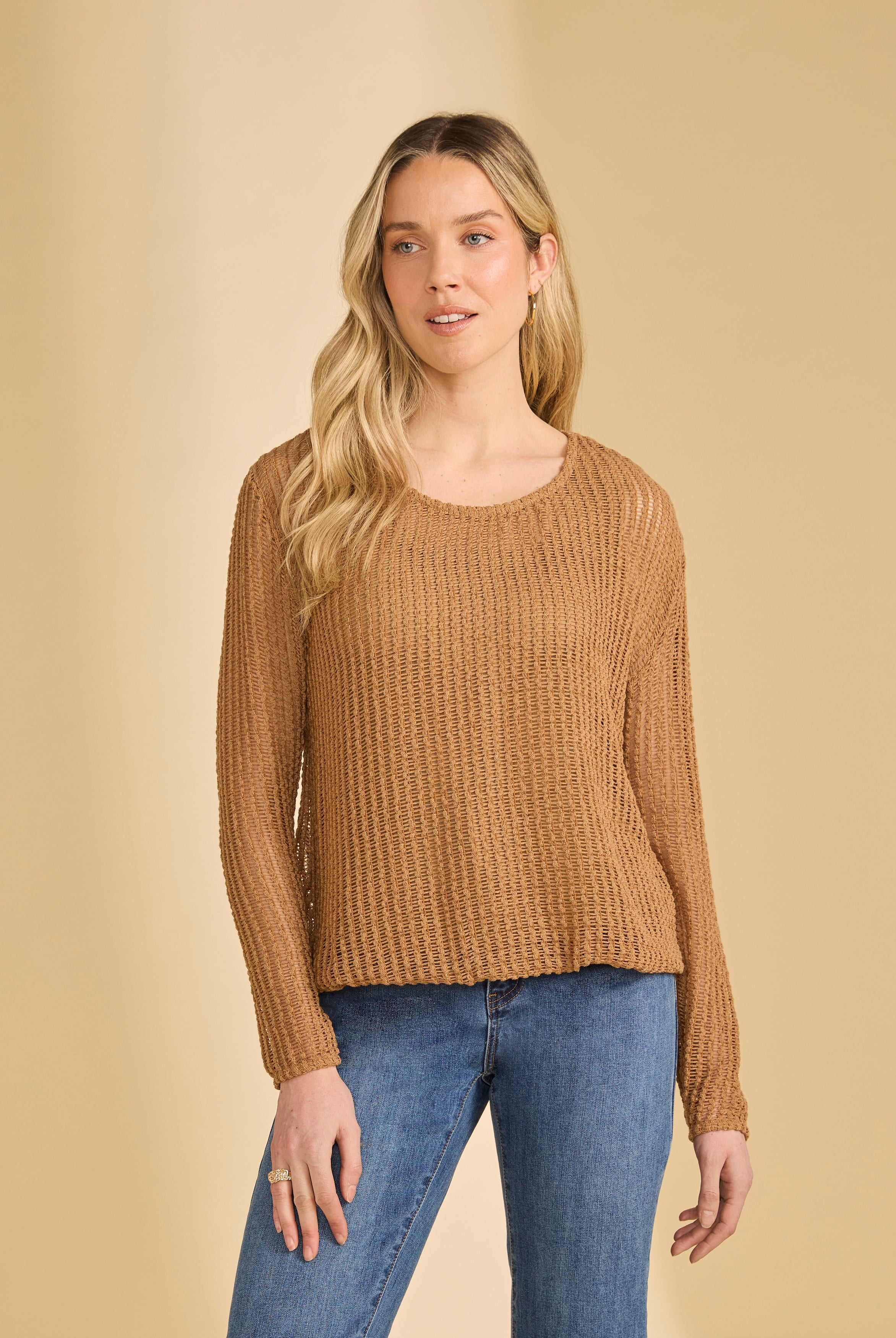 Front view of tan mesh long sleeve top with scoop neck paired with jeans by French Dressing Jeans (FDJ)