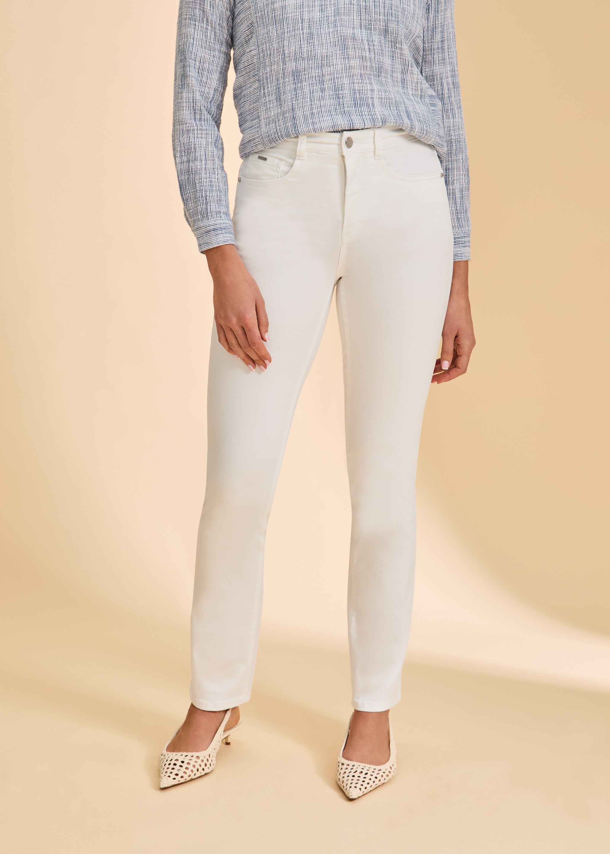 Close-up front view of white straight-leg jeans, showcasing sleek lines by French Dressing Jeans (FDJ)
