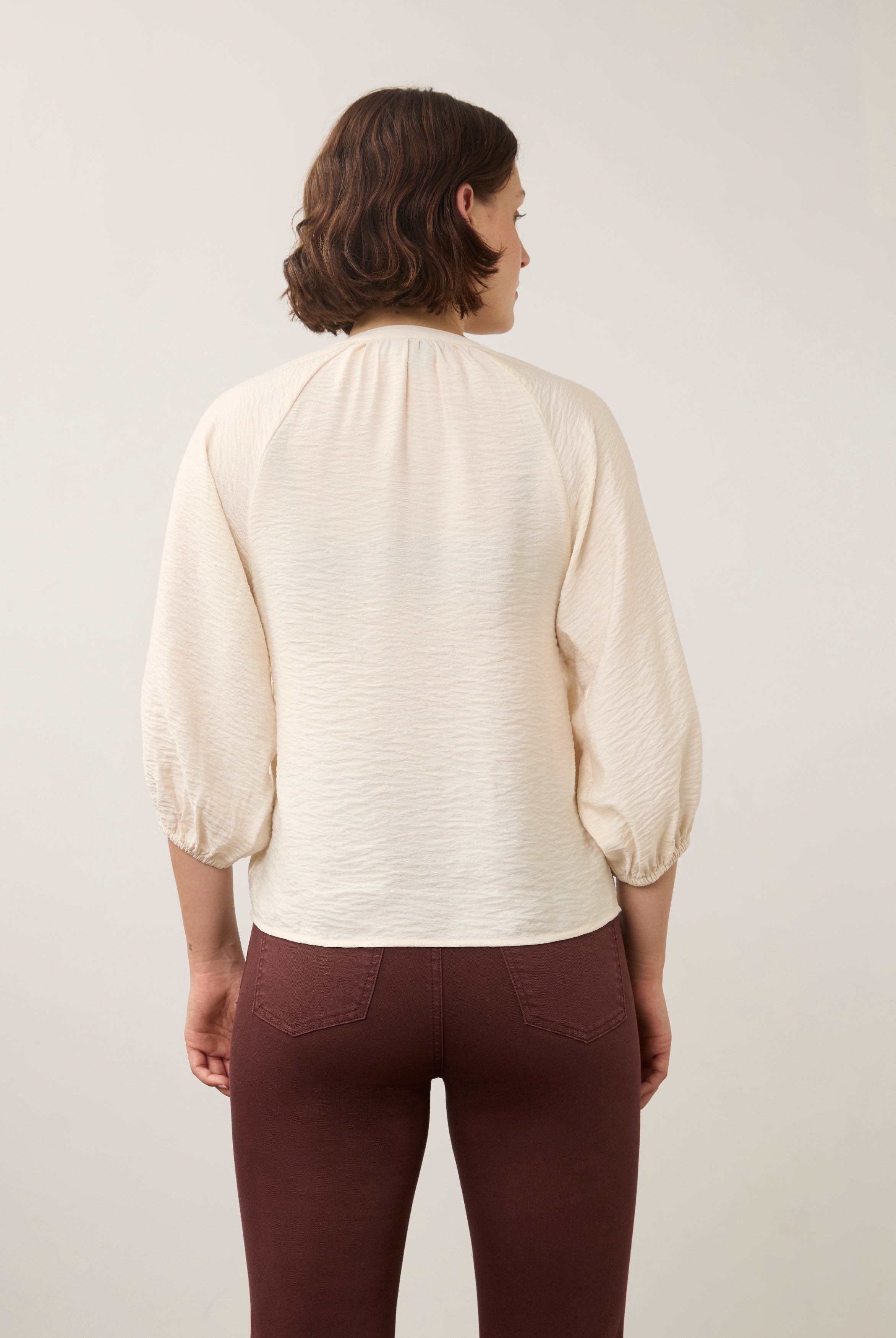 Back view of cream blouse highlighting puff sleeves by French Dressing Jeans (FDJ)