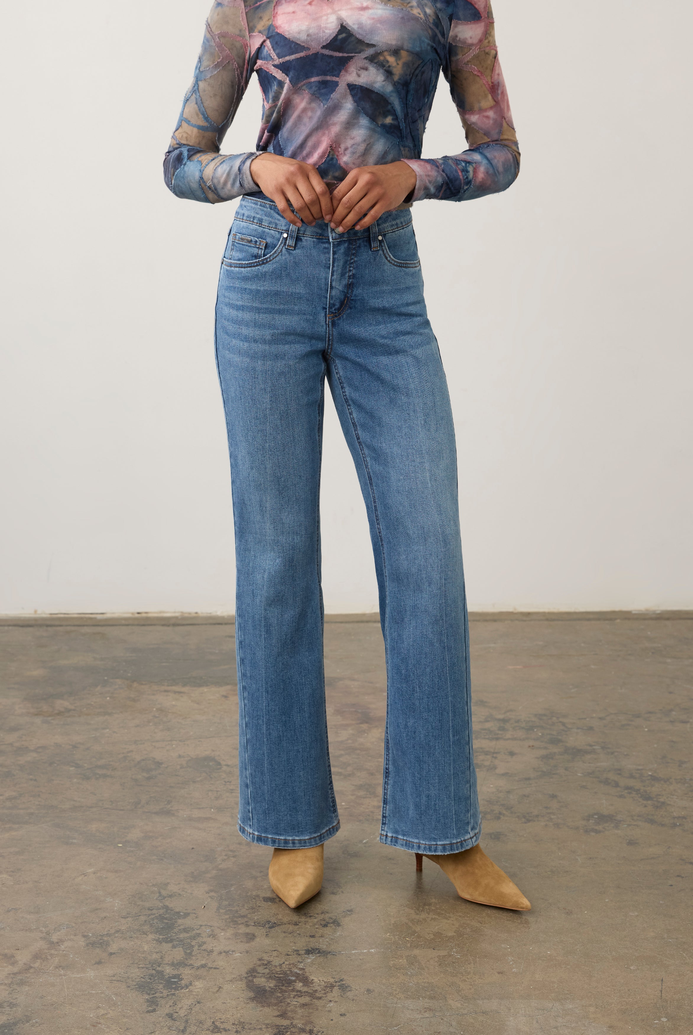Front view of medium wash denim pants showing high-rise waist and bootcut style by French Dressing Jeans (FDJ) par French Dressing Jeans (FDJ)