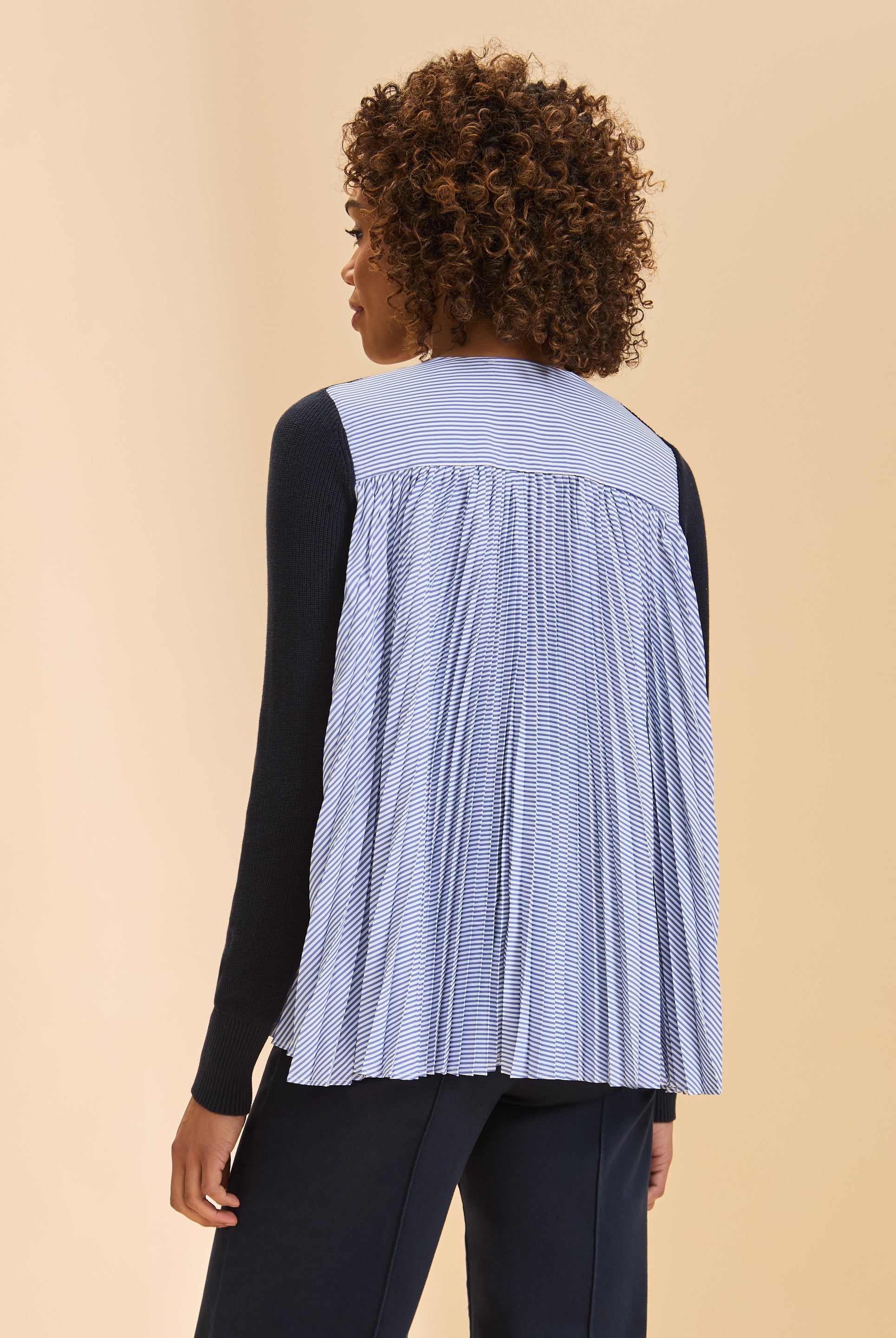 Back view of navy cardigan highlighting striped pleated fabric detail by French Dressing Jeans (FDJ)