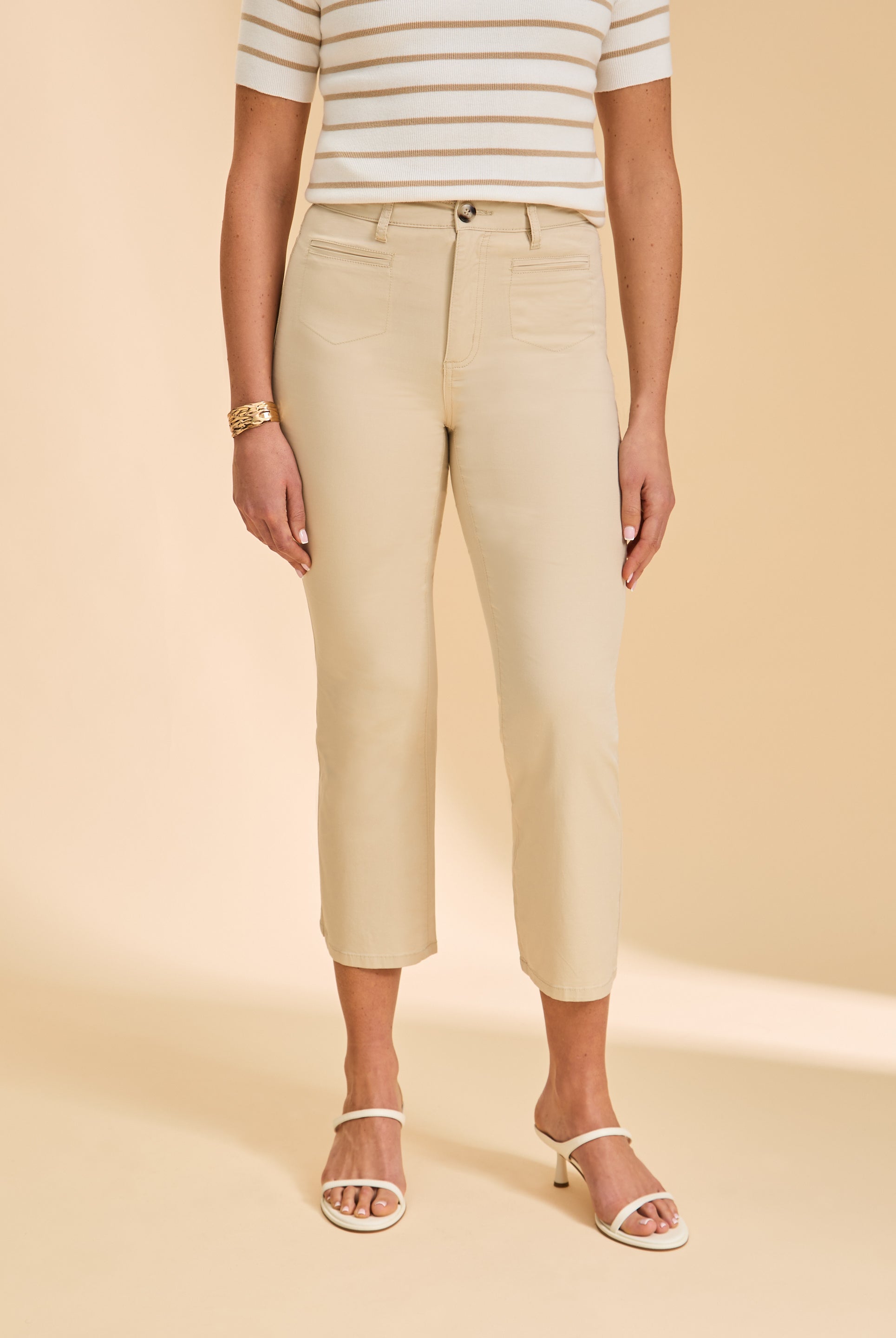 Close-up of cream pants highlighting high-rise design and slim fit by French Dressing Jeans (FDJ)