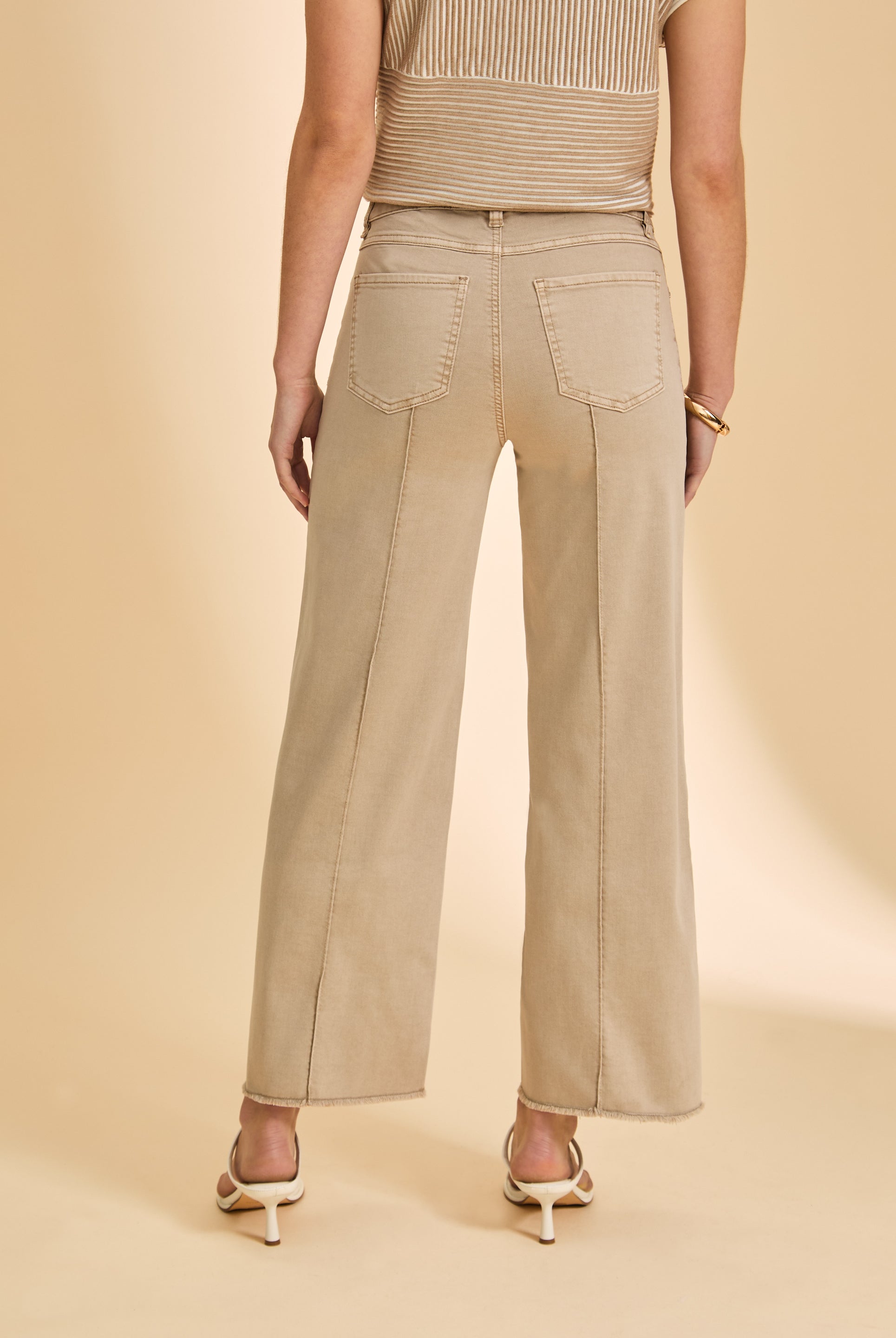 Beige wide-leg pants back view showing patch pockets by French Dressing Jeans (FDJ)