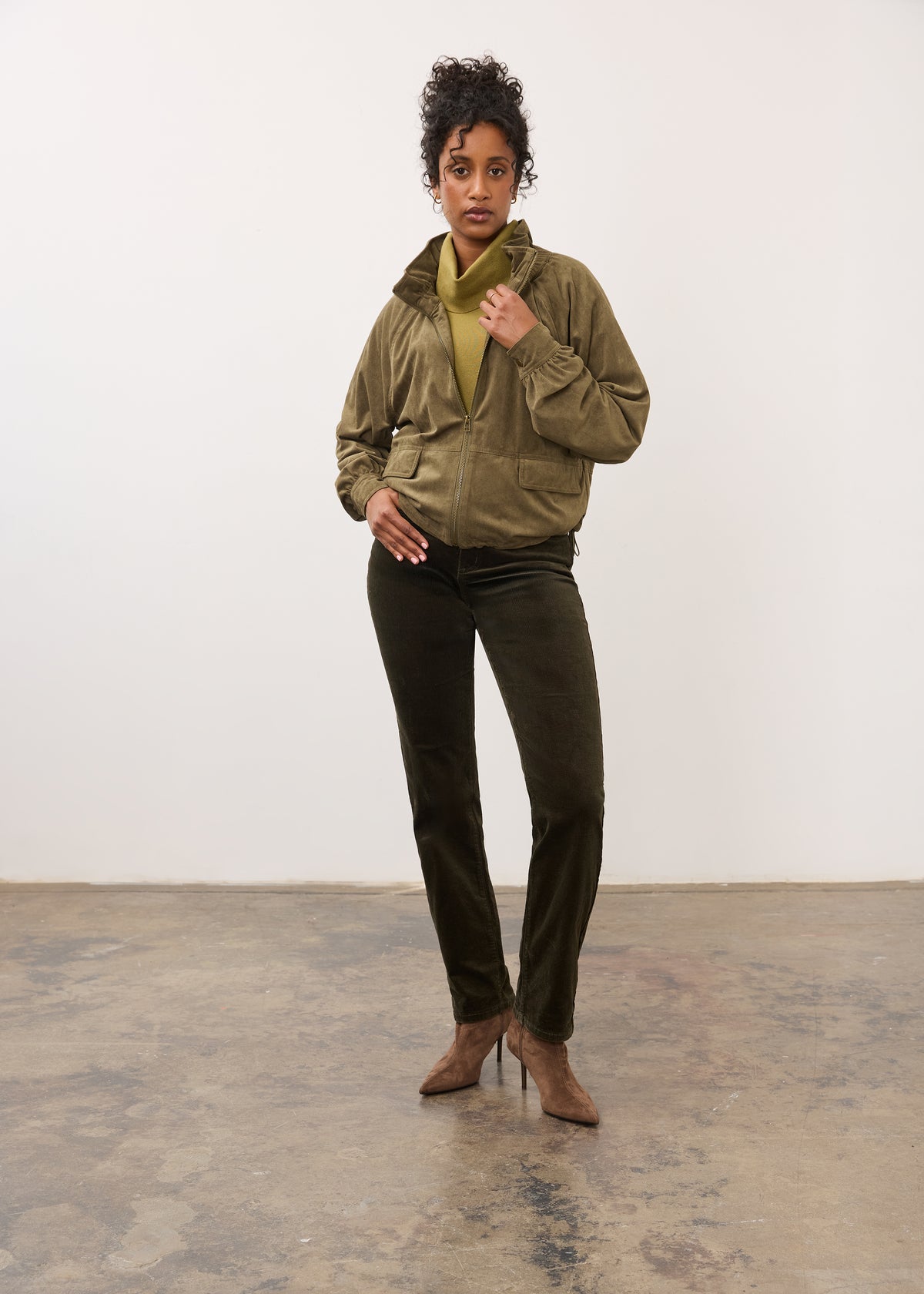 Full view of olive jacket and pants ensemble with pointed heels by French Dressing Jeans (FDJ)