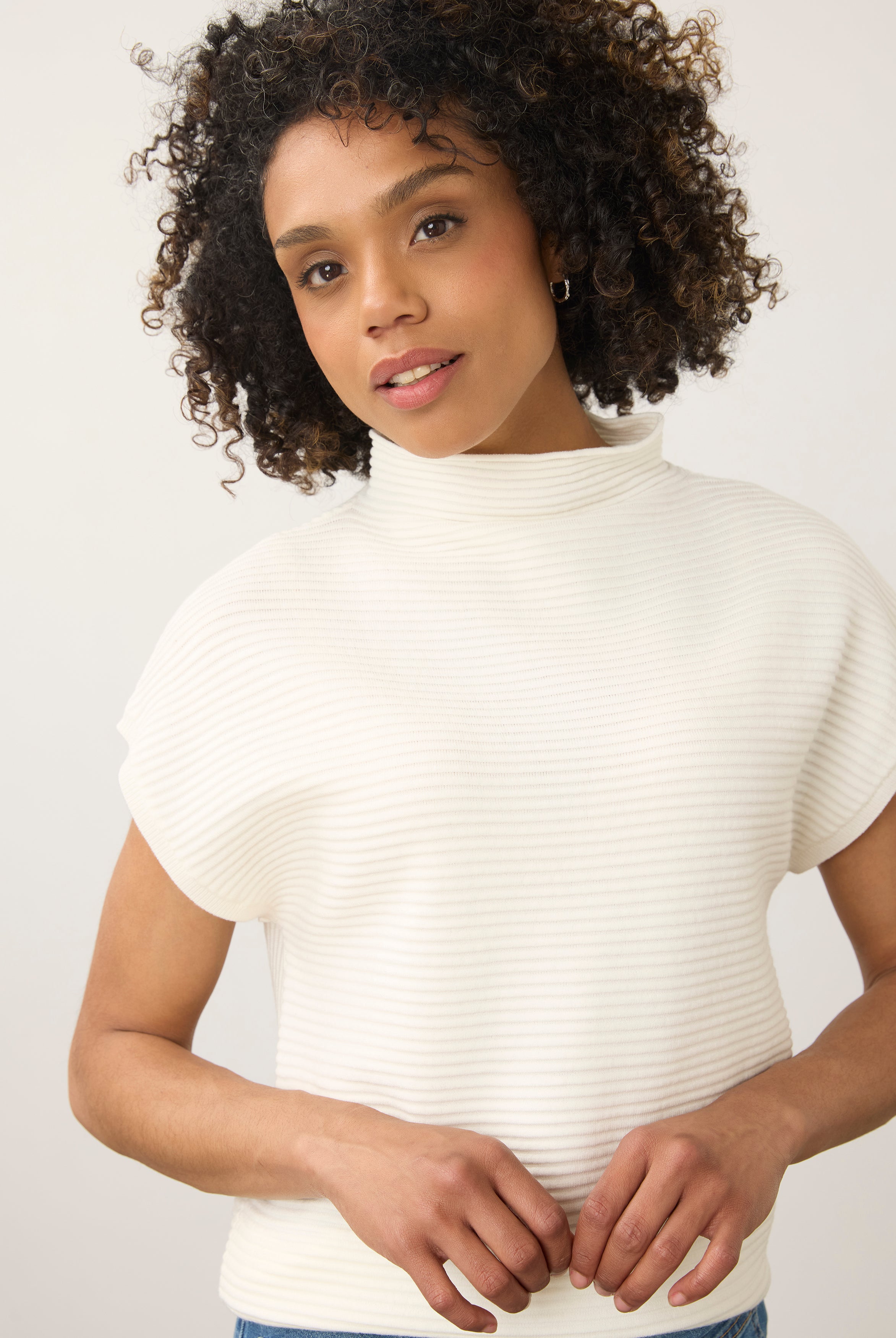 Close-up of white ribbed top showing high collar and short sleeves by French Dressing Jeans (FDJ)