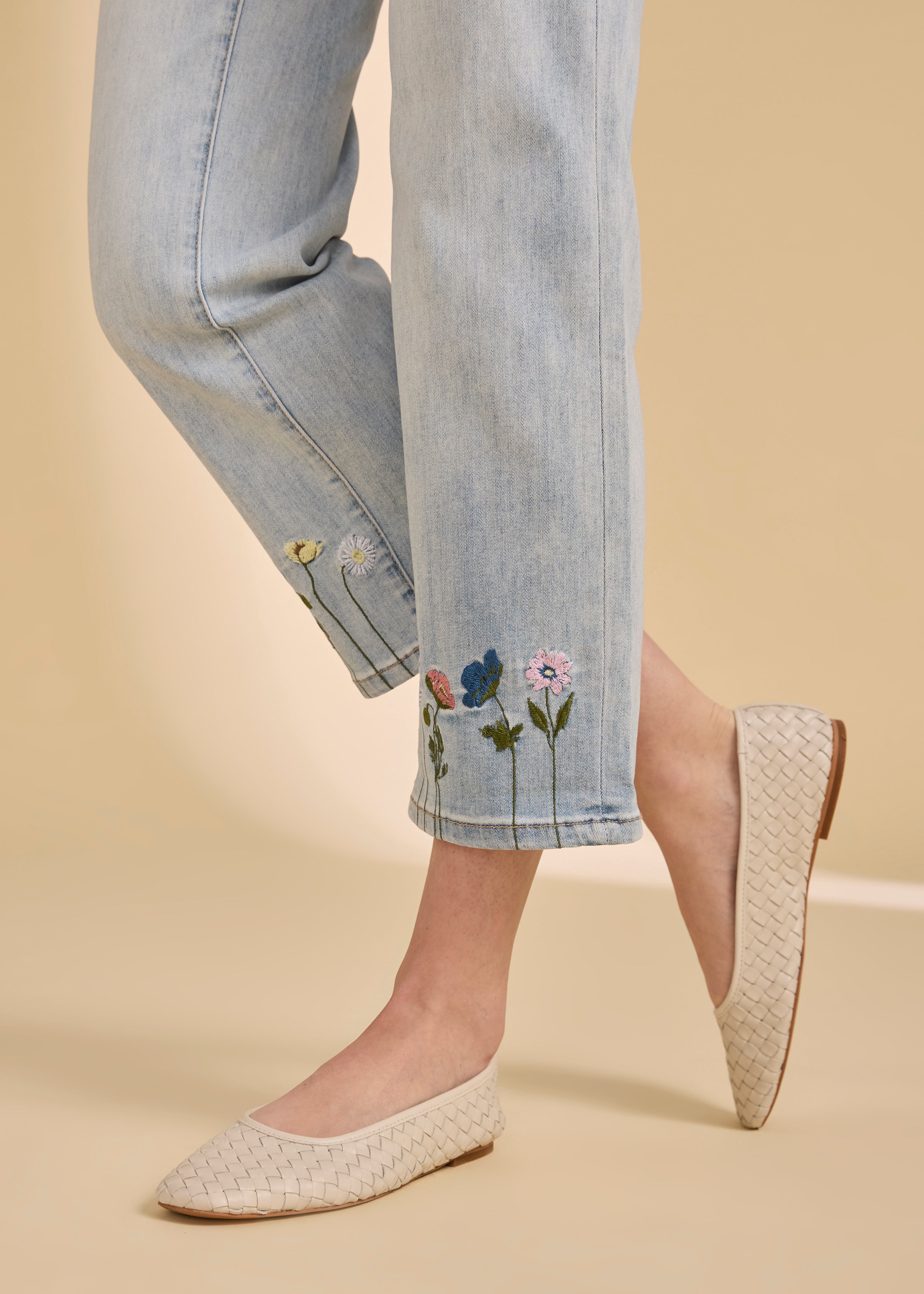 Detail of floral embroidery on the cuff of light medium denim by French Dressing Jeans (FDJ)