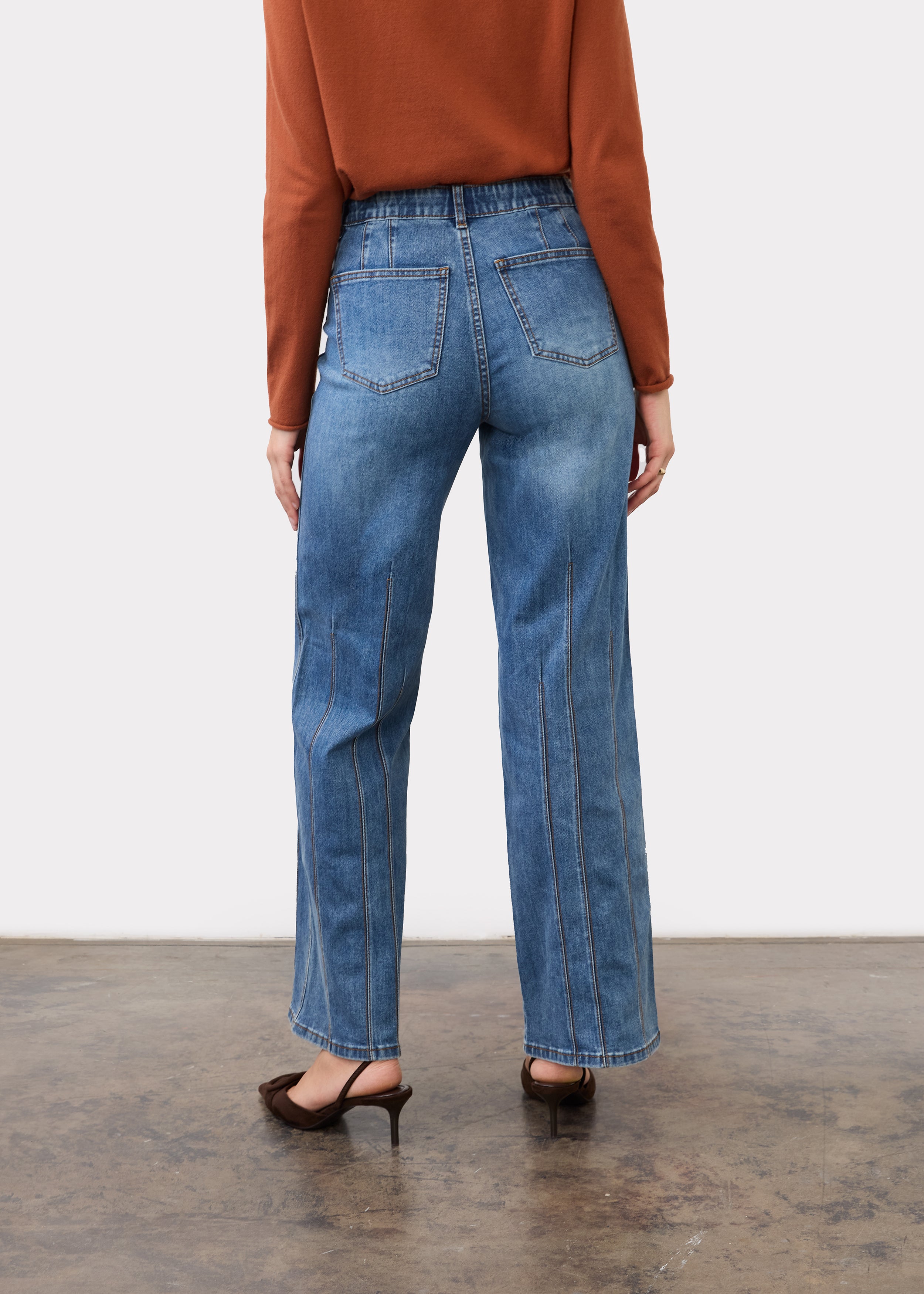 Back view of indigo jeans showing patch pockets and straight leg silhouette by French Dressing Jeans (FDJ)