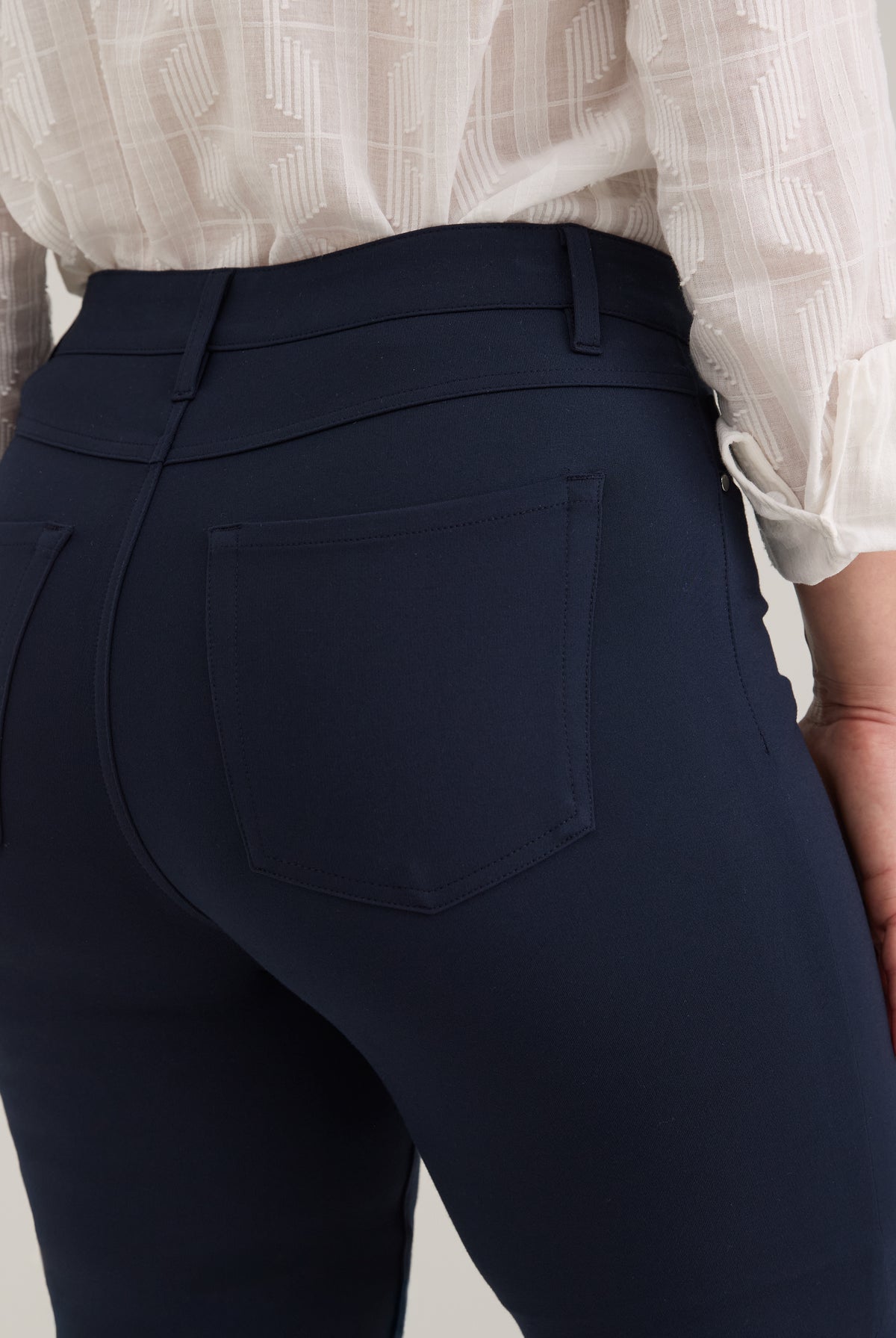 Close-up of navy pants showing back patch pockets and texture by French Dressing Jeans (FDJ)