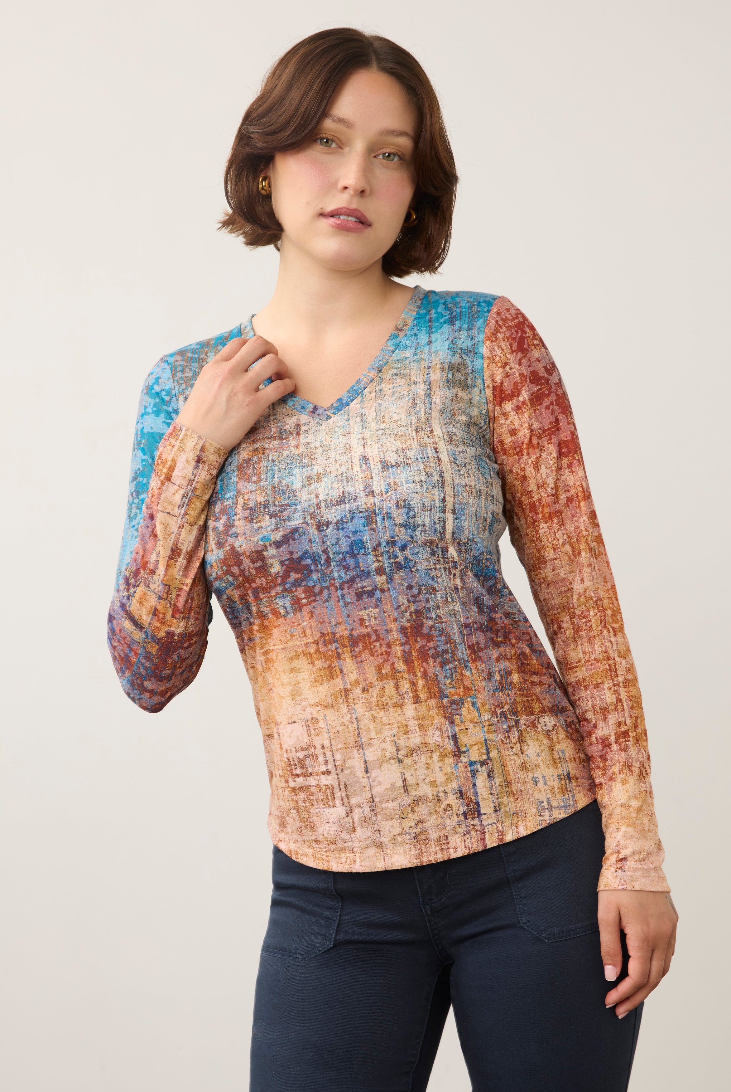 Front view of long sleeve V-neck top in vibrant gradient pattern by French Dressing Jeans (FDJ)