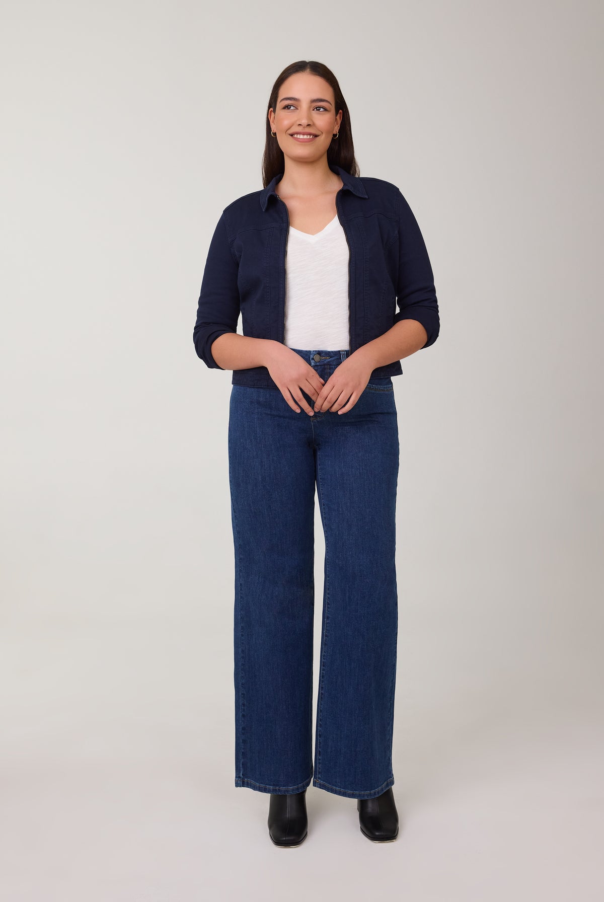 Model in wide-leg Delight jeans with a navy jacket by French Dressing Jeans (FDJ)