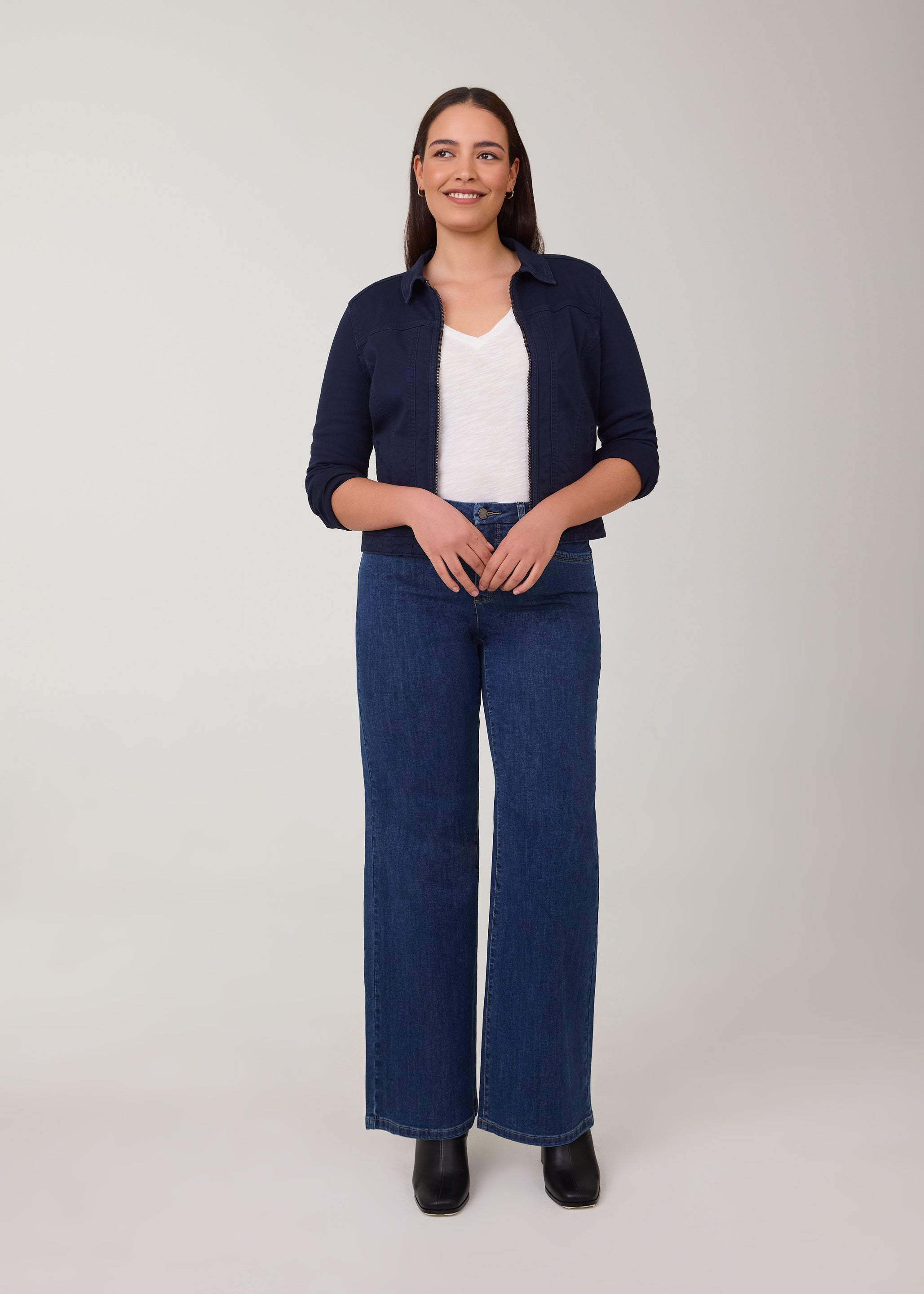 Model in wide-leg Delight jeans with a navy jacket by French Dressing Jeans (FDJ)