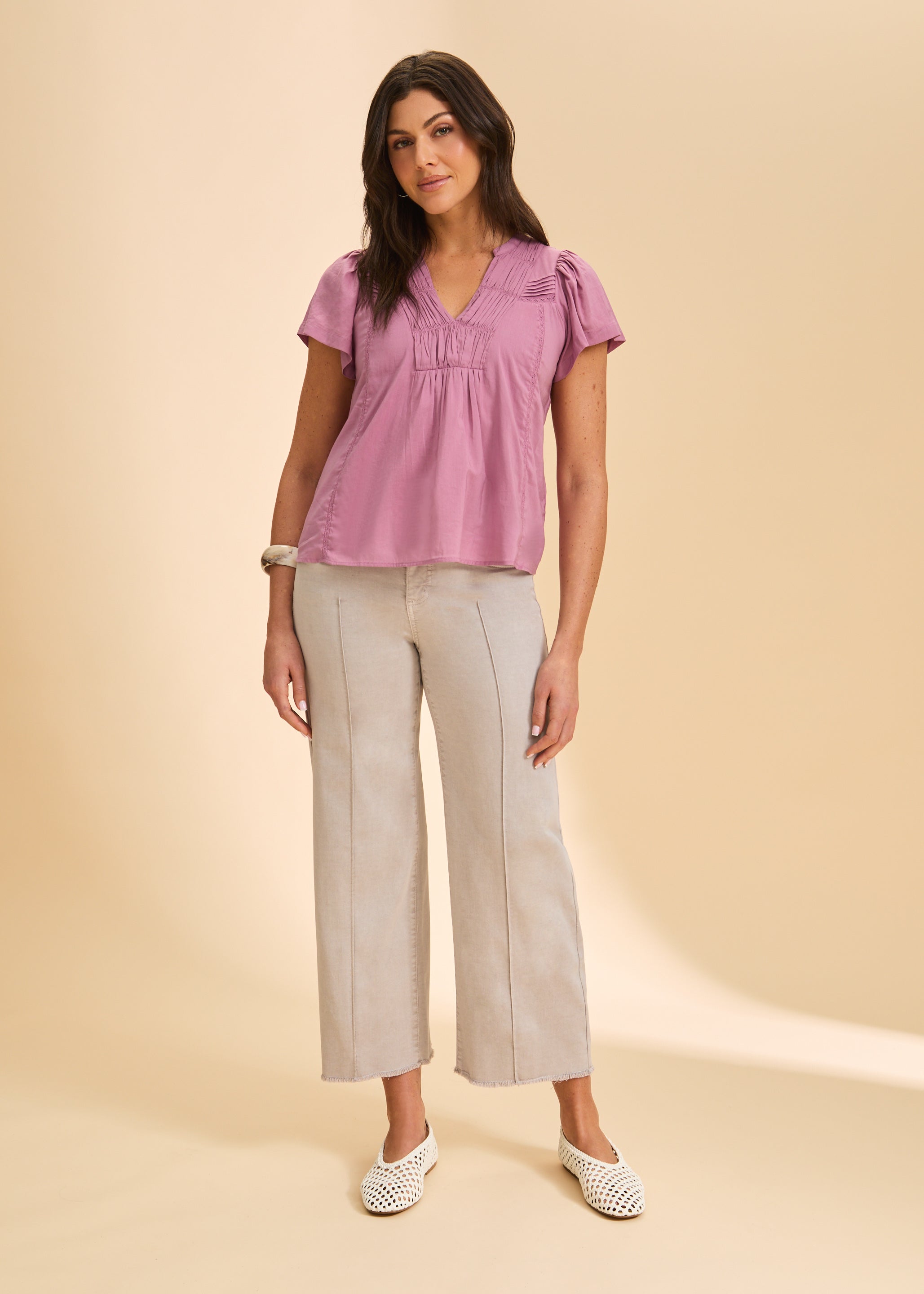 Full view of lavender short-sleeve top paired with beige pants by French Dressing Jeans (FDJ)