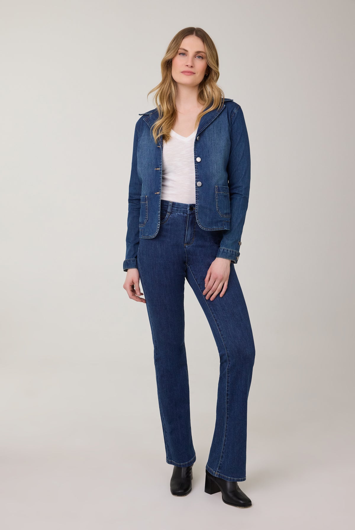 Model in bootcut denim jeans in dark Delight color by French Dressing Jeans (FDJ)