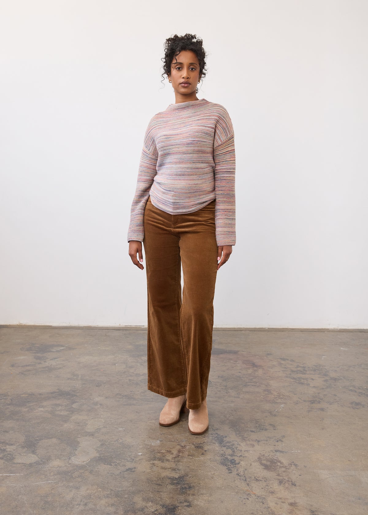 Full view of model in camel Olivia wide leg pants paired with a striped sweater by French Dressing Jeans (FDJ)