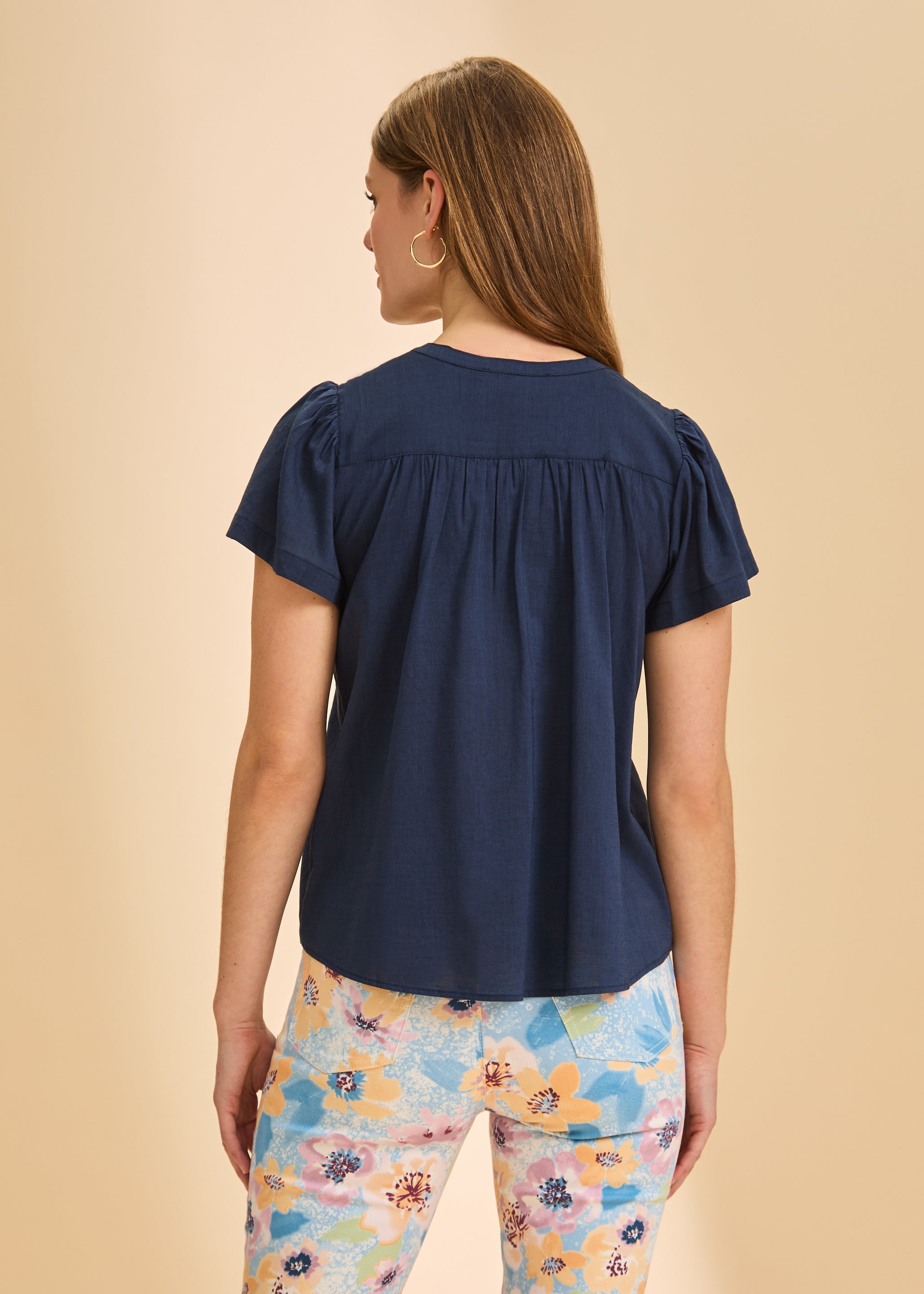 Back view of navy short-sleeve top showcasing yoke detail by French Dressing Jeans (FDJ)