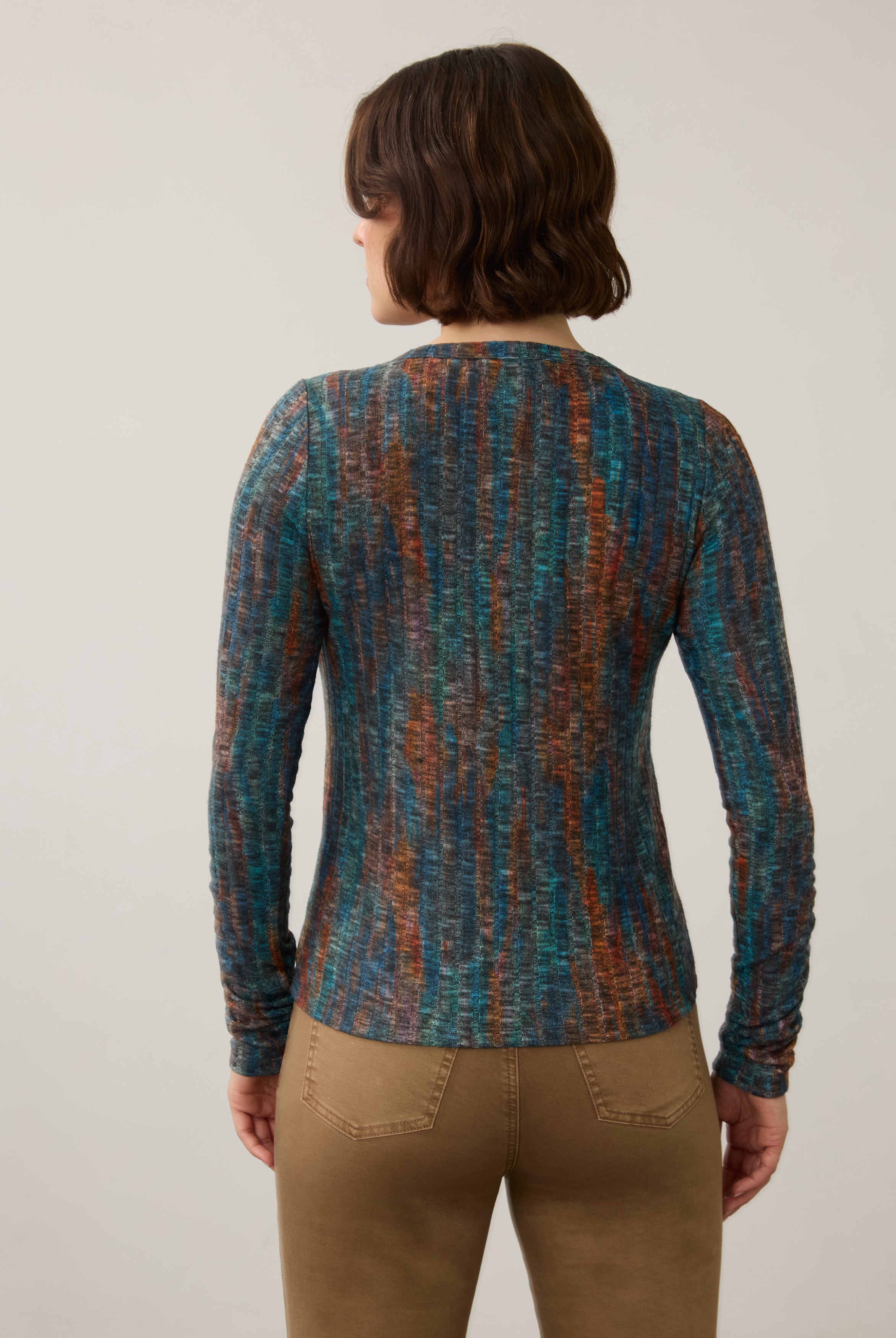 Back view of striped V-neck top, highlighting seamless design and earthy tones by French Dressing Jeans (FDJ)