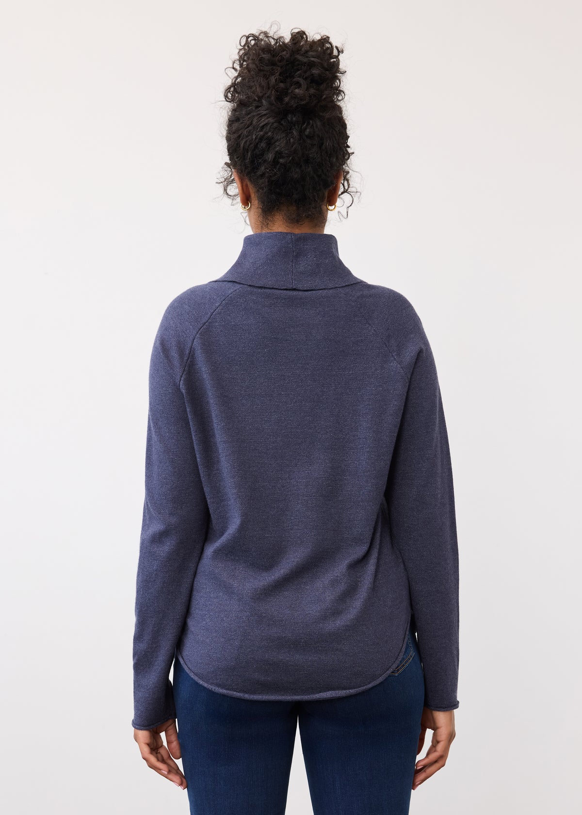 Back view of navy sweater highlighting rounded hemline by French Dressing Jeans (FDJ)