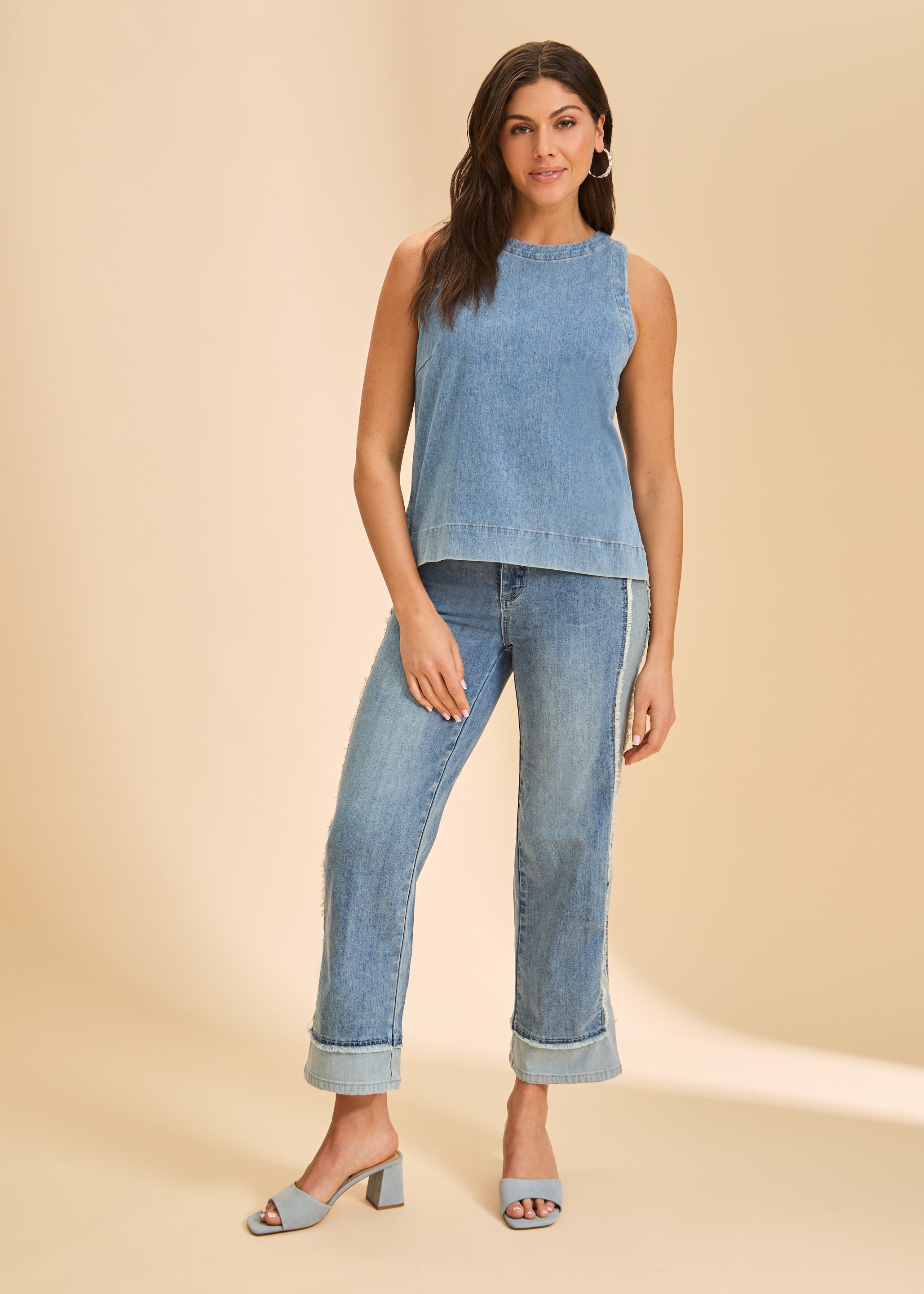 Full view of light blue sleeveless top paired with cuffed jeans by French Dressing Jeans (FDJ)