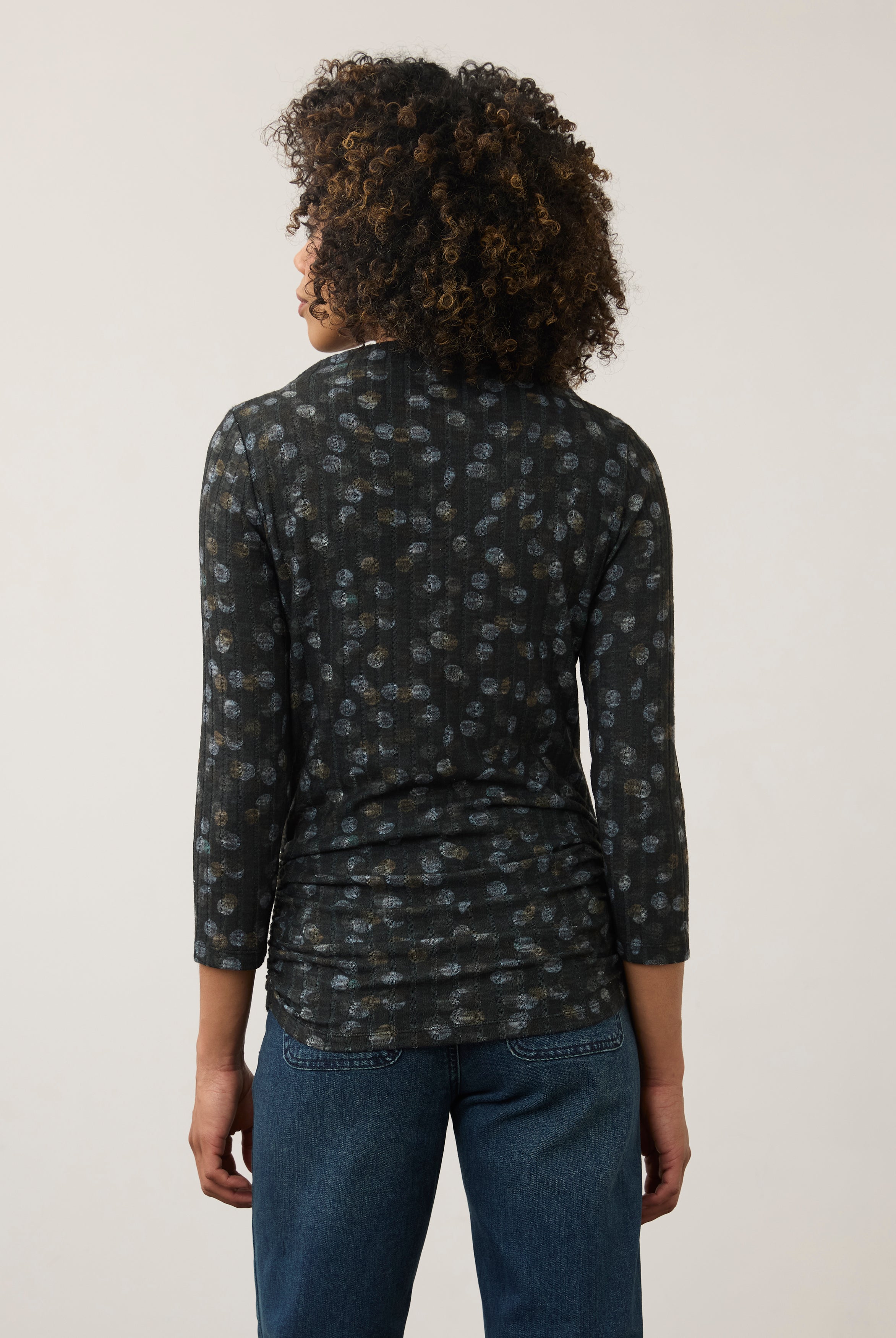 Back view of black polka dot top, highlighting the seamless design and fit by French Dressing Jeans (FDJ)