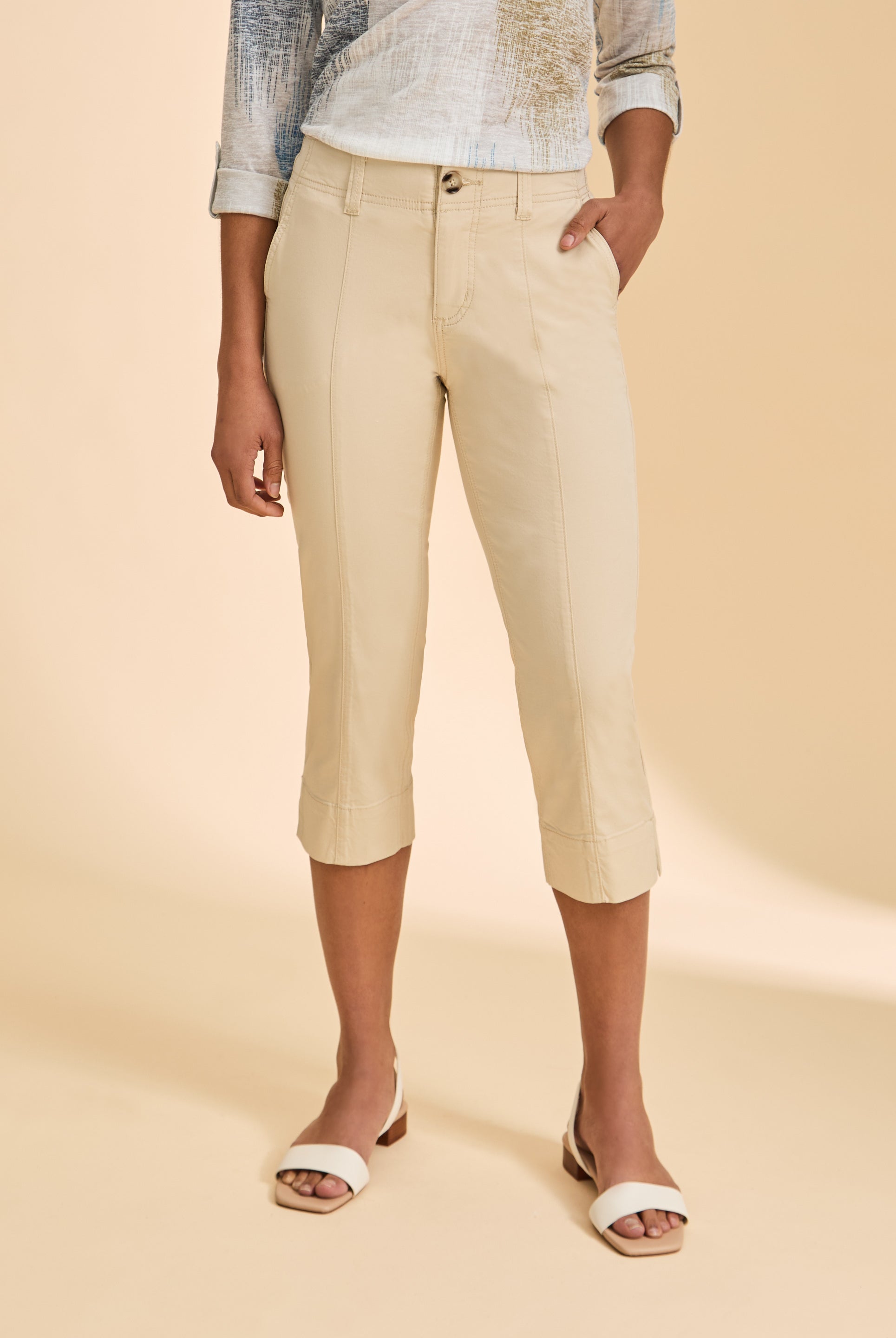 Close-up of cream crop pants showcasing high-rise fit and sleek design by French Dressing Jeans (FDJ)
