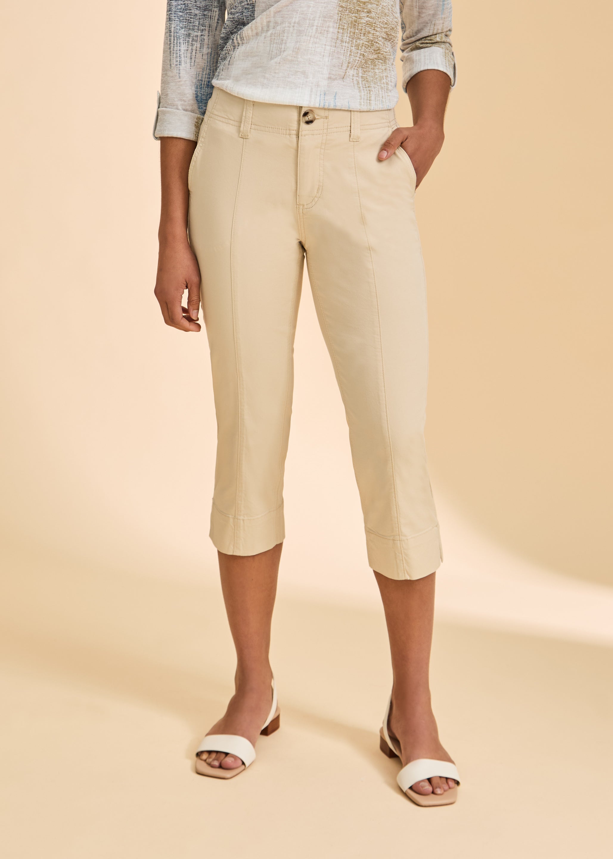 Close-up of cream crop pants showcasing high-rise fit and sleek design by French Dressing Jeans (FDJ)
