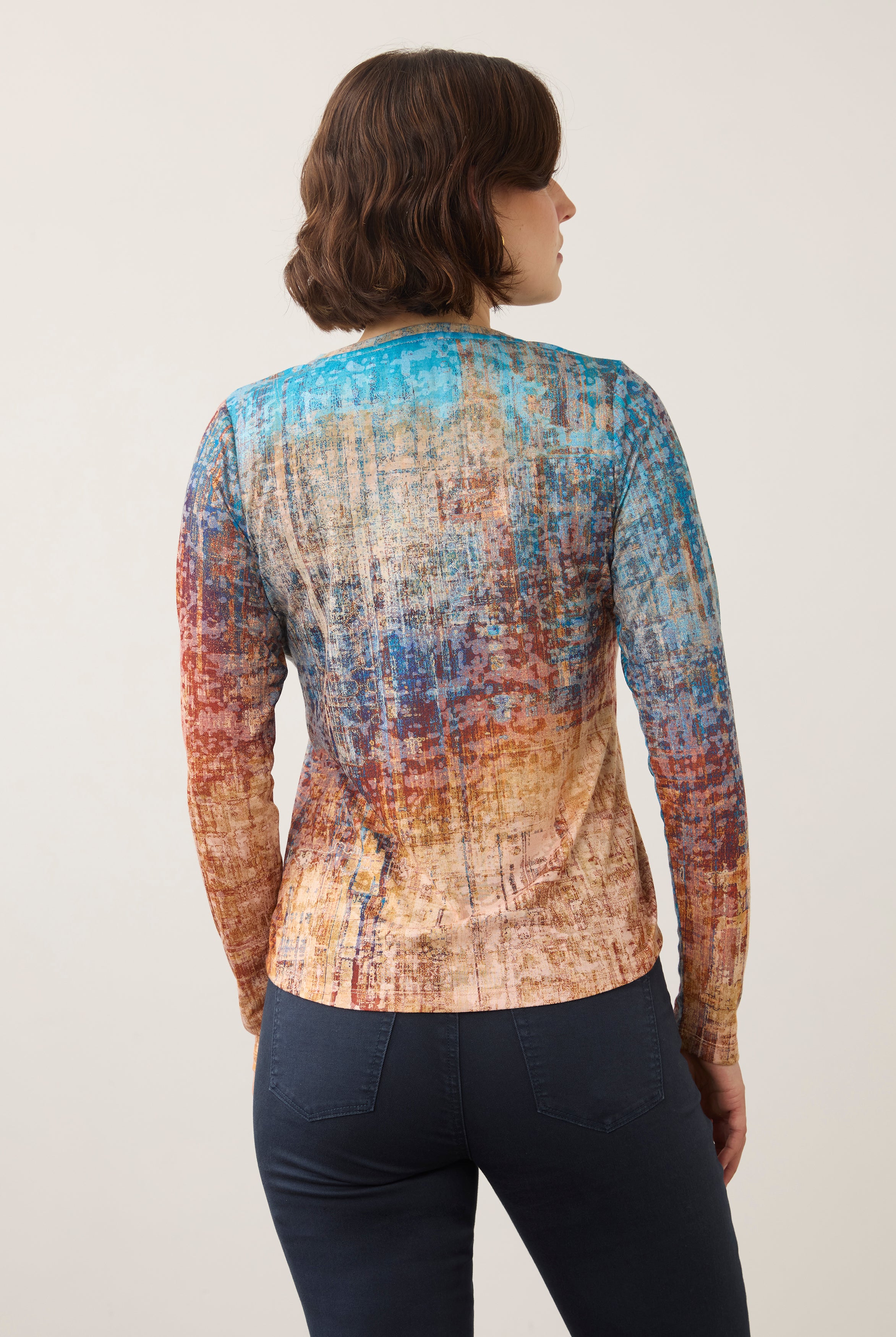 Back view of long sleeve top in colorful gradient pattern showing seamless fit by French Dressing Jeans (FDJ)