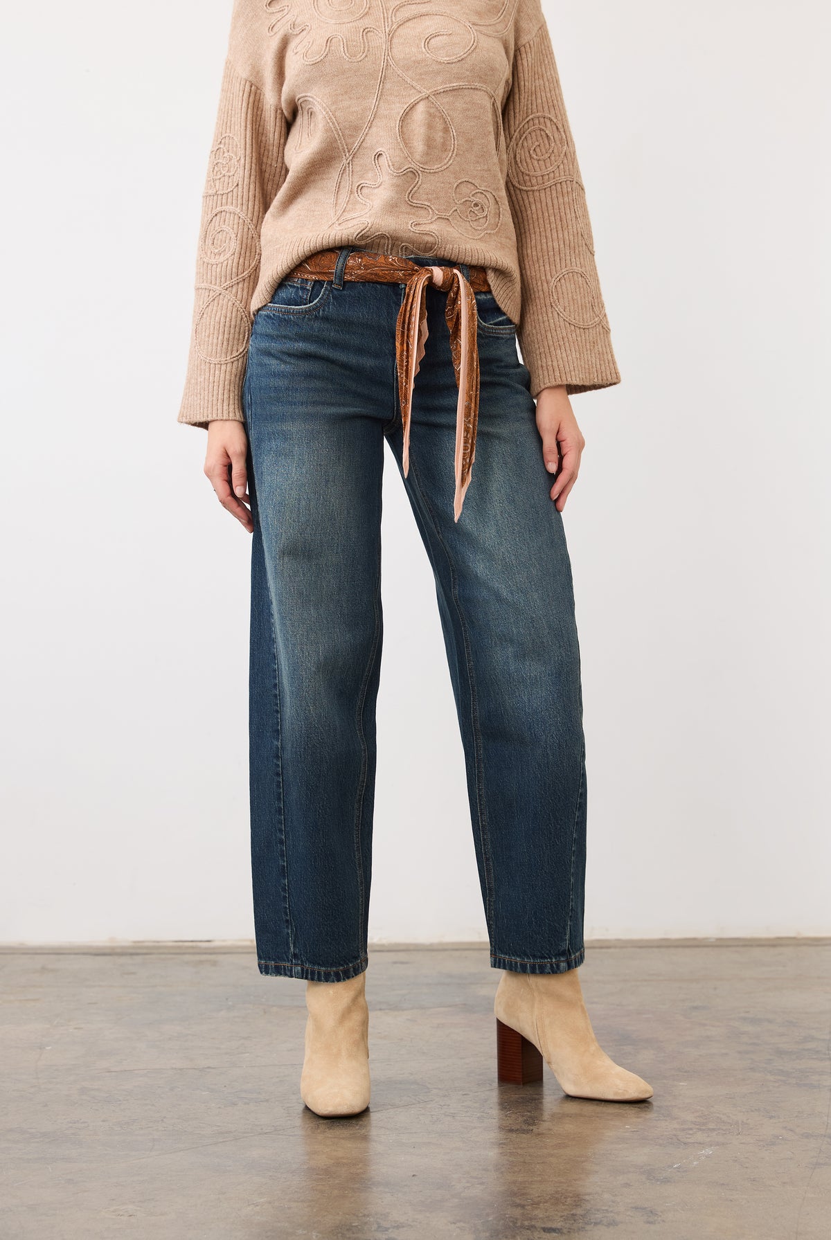 Front view of medium blue jeans with mid-rise waist, styled with a belt by French Dressing Jeans (FDJ)