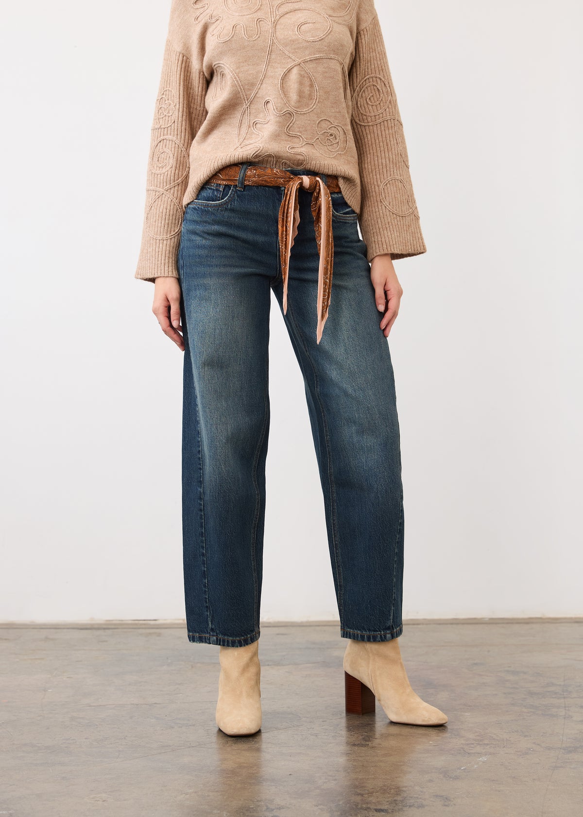 Front view of medium blue jeans with mid-rise waist, styled with a belt by French Dressing Jeans (FDJ)