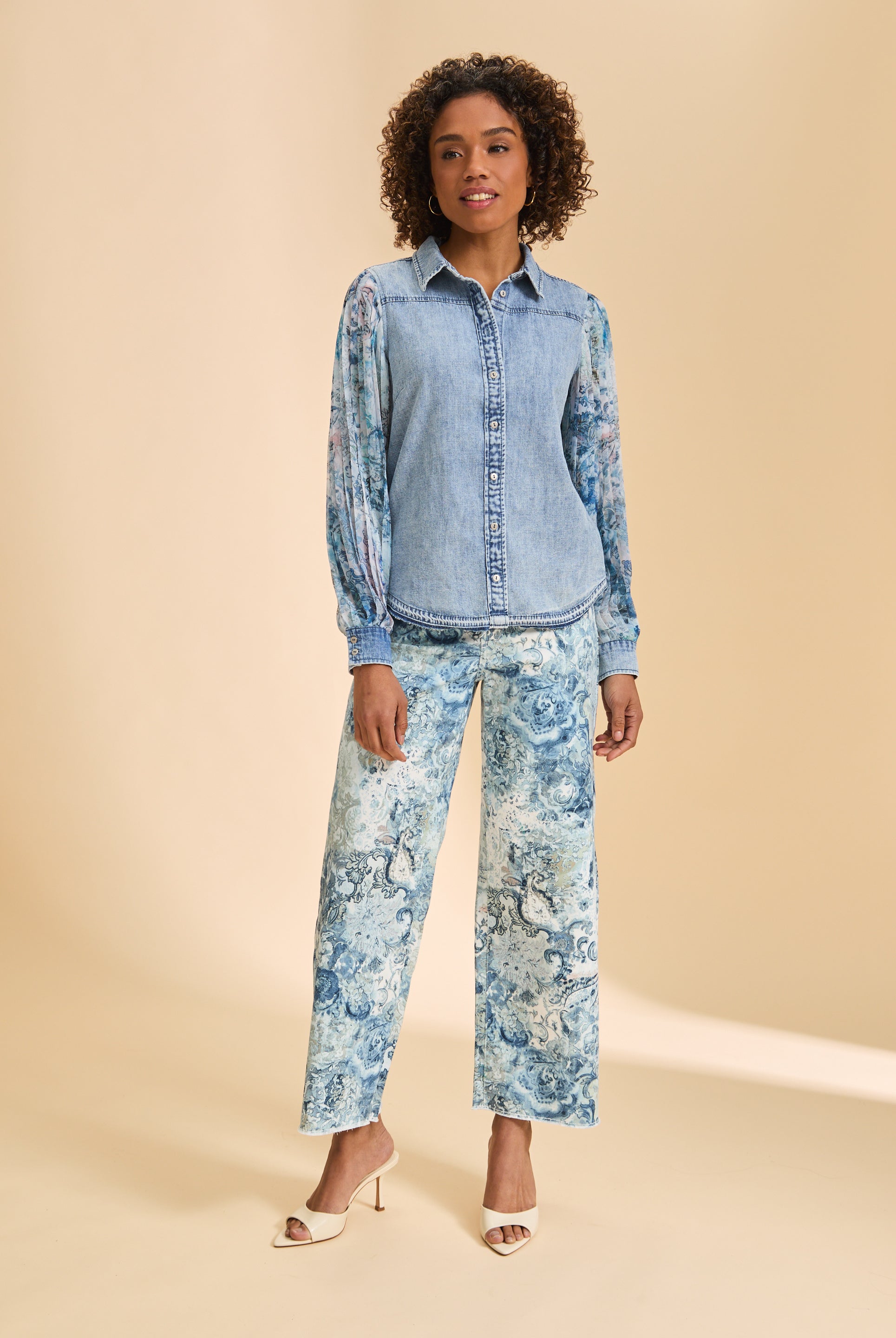 Full view of denim shirt with sheer sleeves paired with patterned pants by French Dressing Jeans (FDJ)