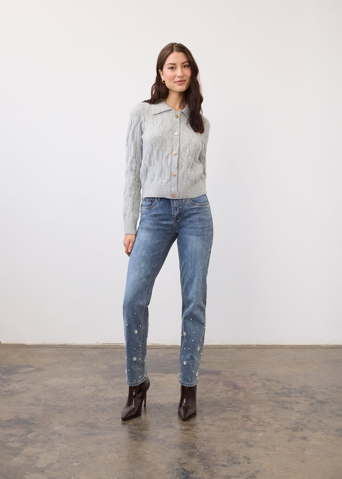 Full body view of gray cabled cardigan paired with jeans and boots by French Dressing Jeans (FDJ)