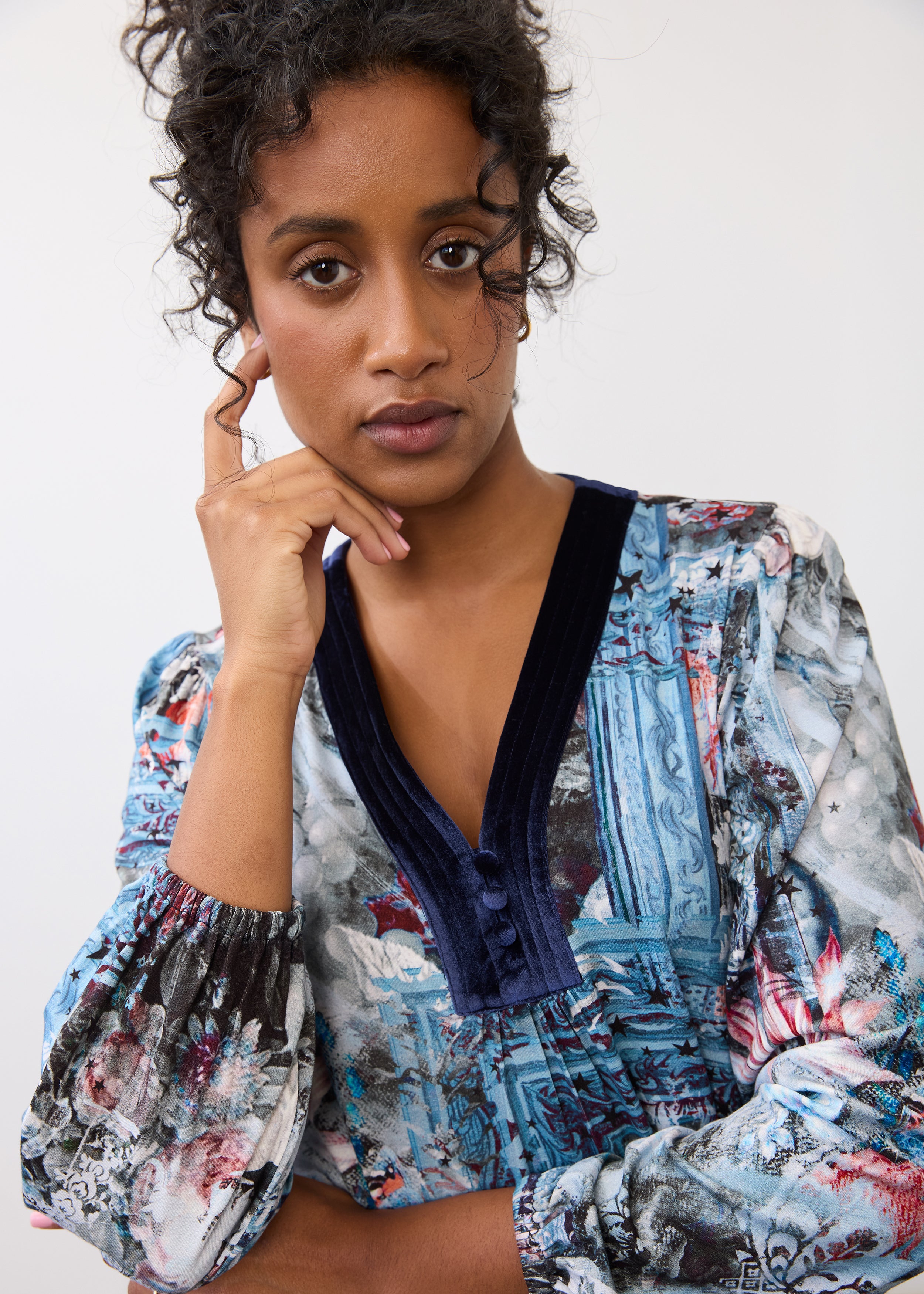 Close-up of V-neck detail on Indigo Gallery long sleeve top, highlighting button design by French Dressing Jeans (FDJ)