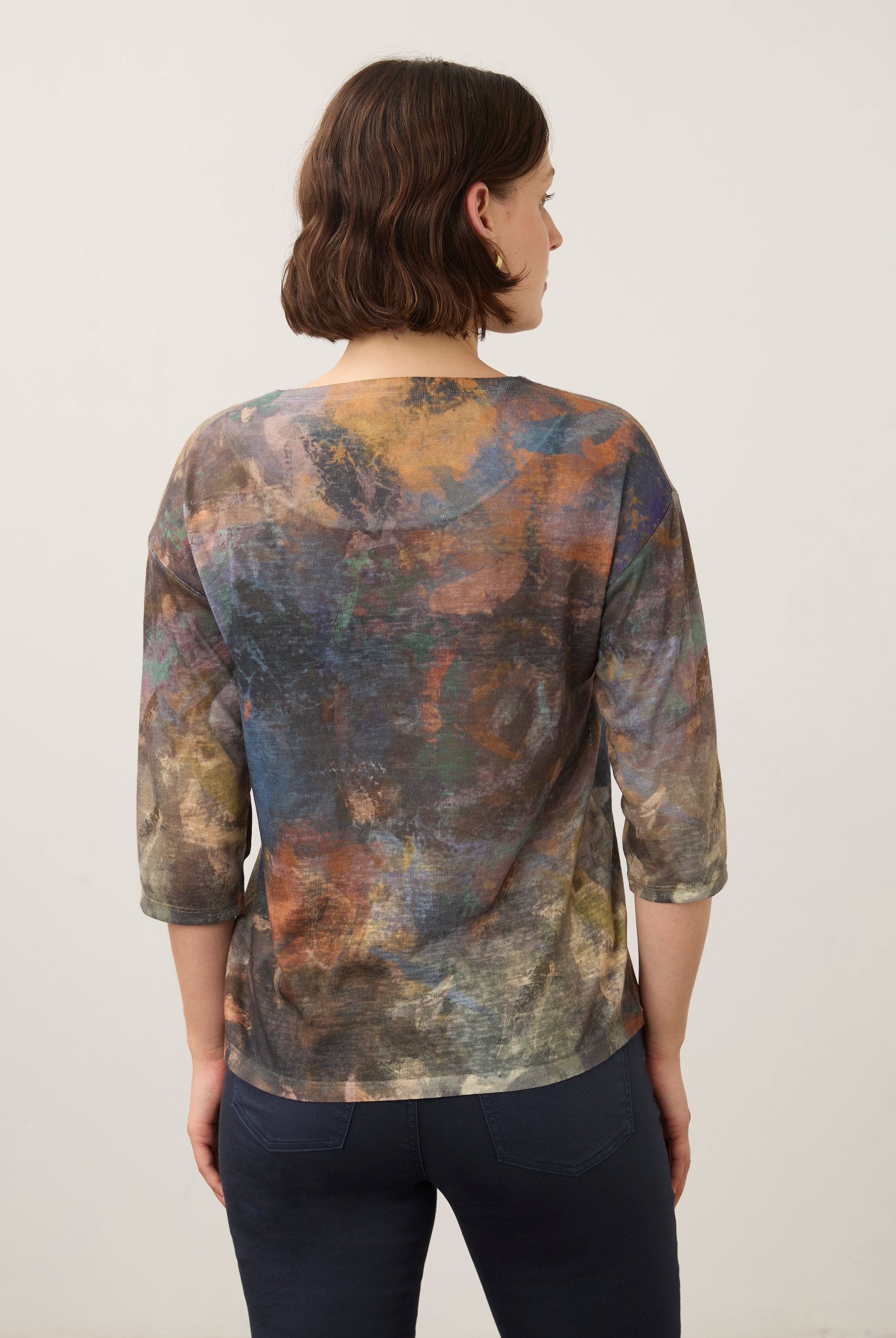 Back view of earthy-toned Henley top with abstract pattern and 3/4 sleeves by French Dressing Jeans (FDJ)