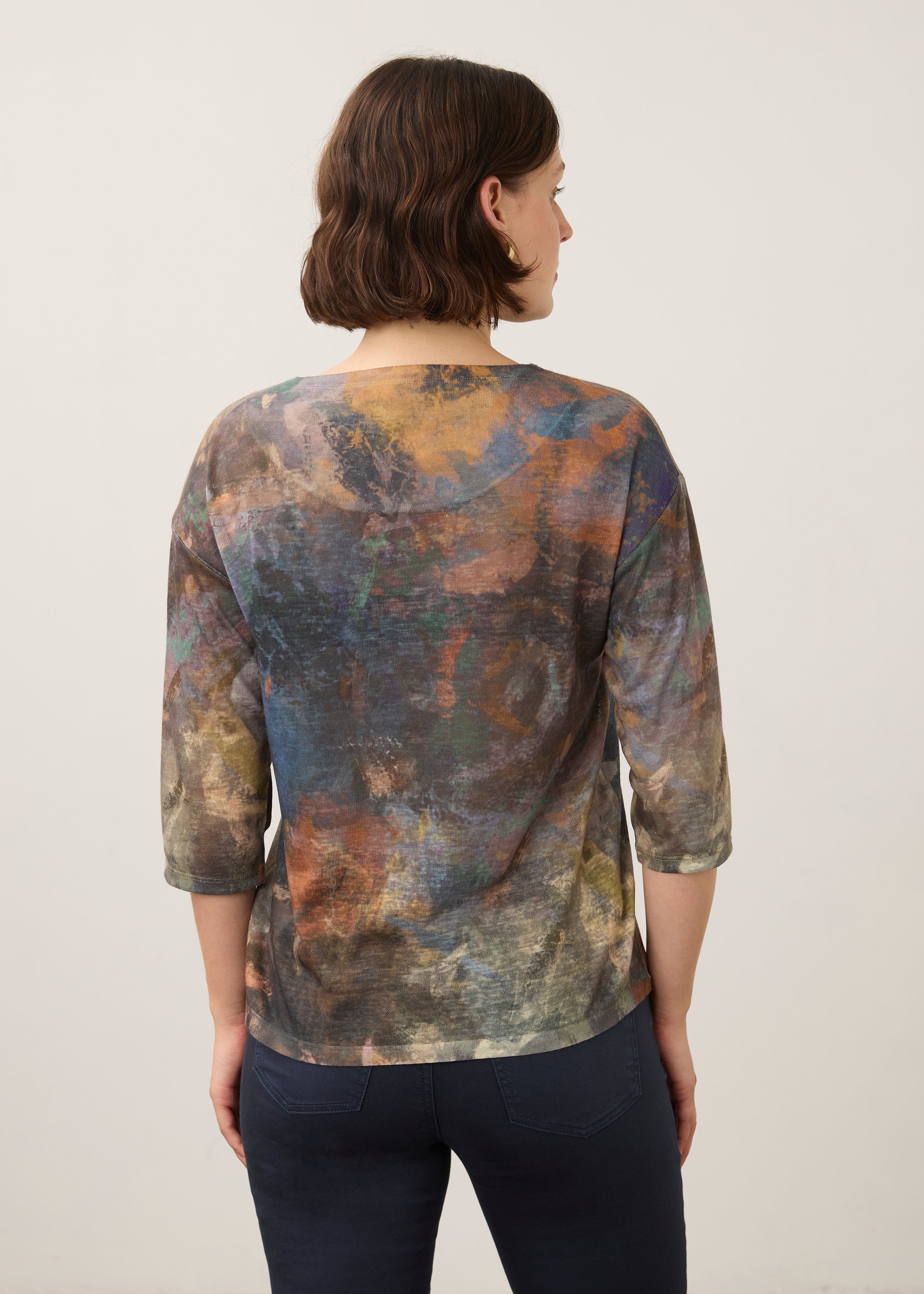 Back view of earthy-toned Henley top with abstract pattern and 3/4 sleeves by French Dressing Jeans (FDJ)