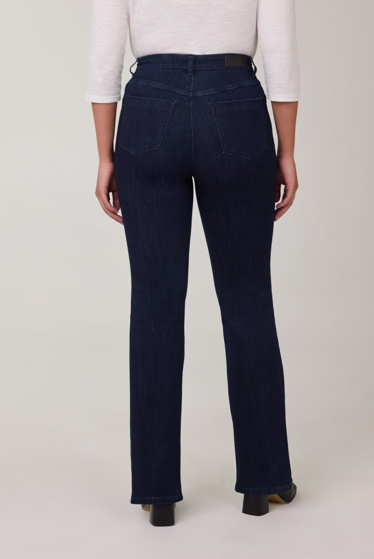 Back view of straight leg jeans in vibrant Delight color with pockets by French Dressing Jeans (FDJ)