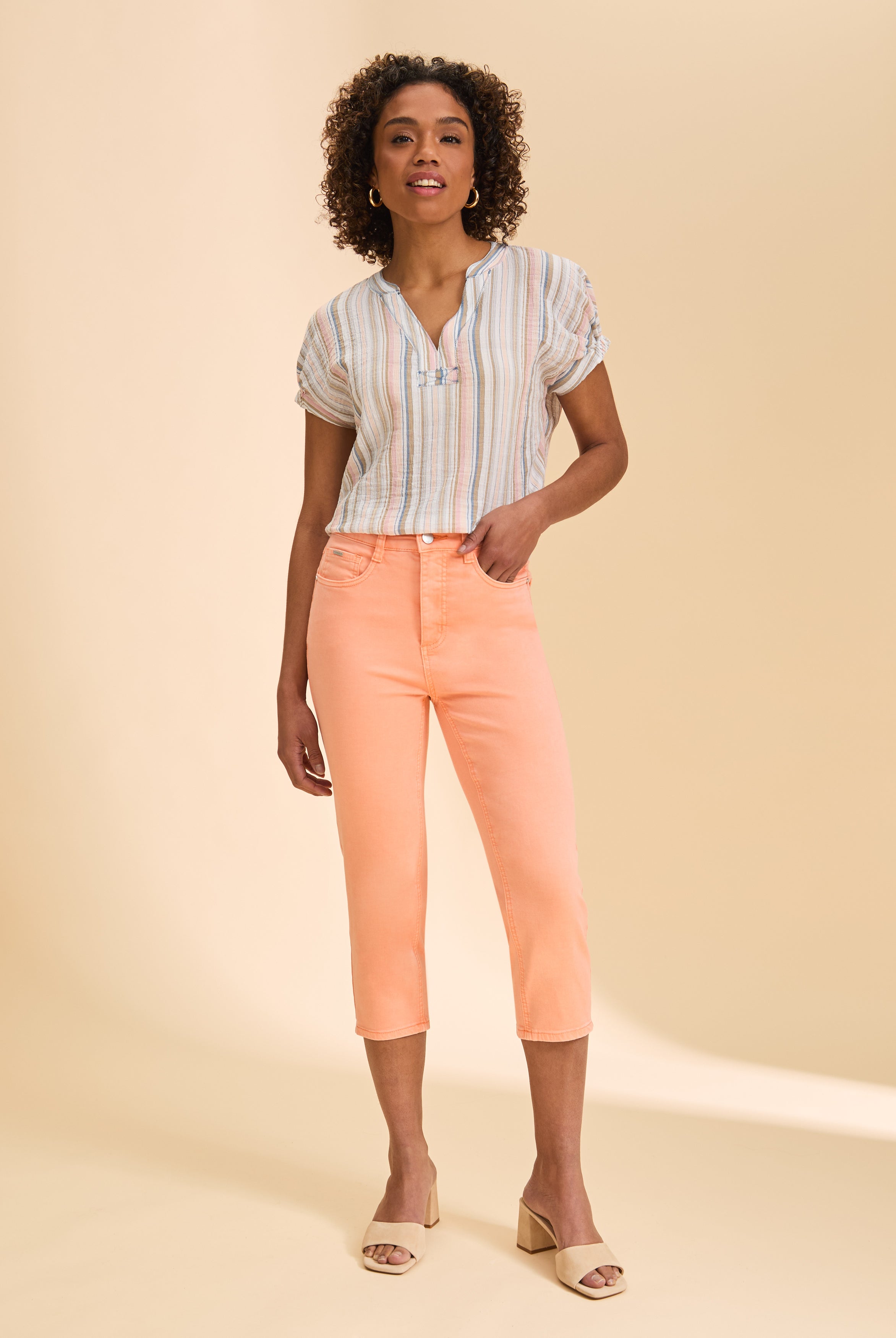 Front view of peach cropped jeans, styled with striped top by French Dressing Jeans (FDJ)