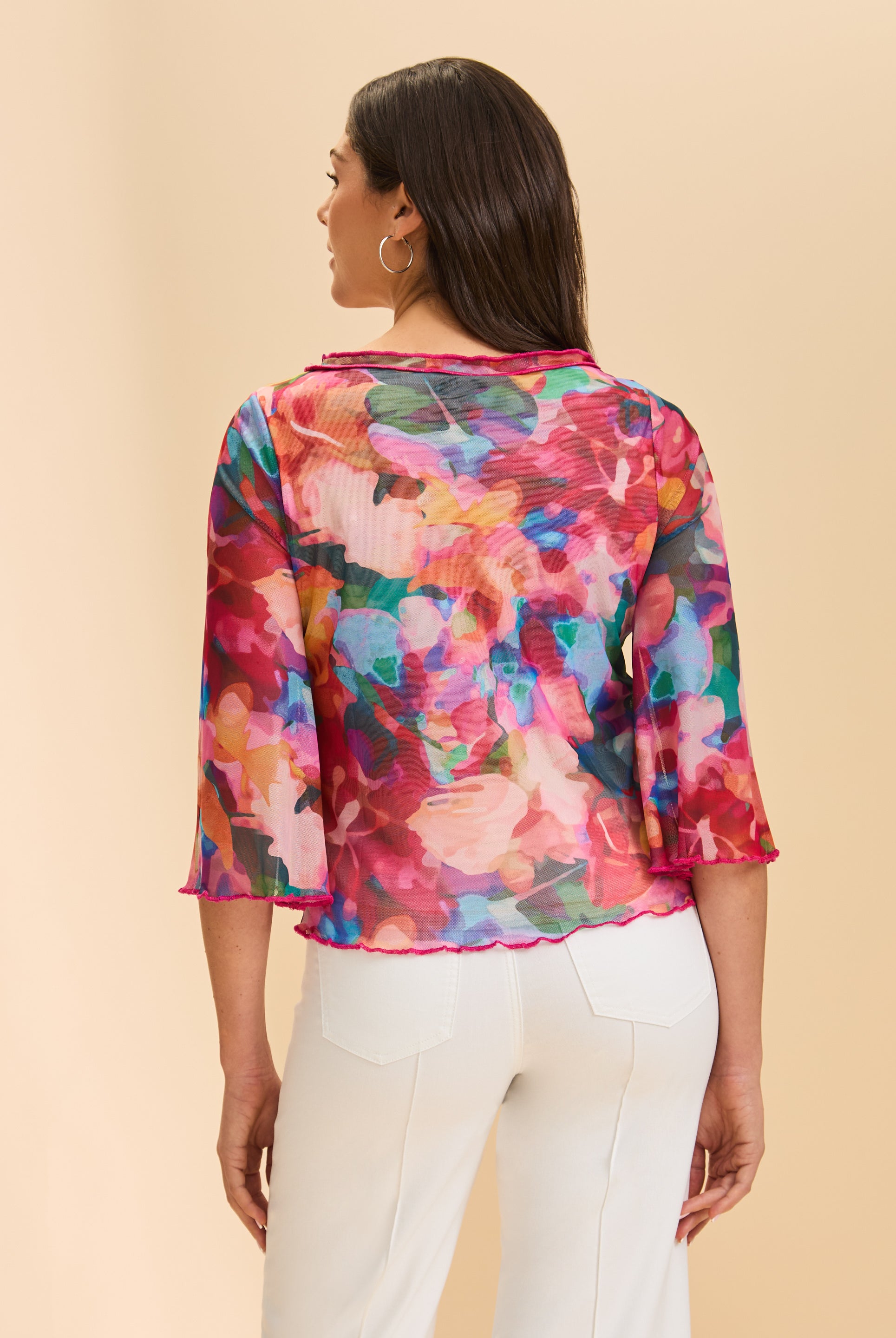 Back view of colorful sheer top displaying vibrant floral pattern by French Dressing Jeans (FDJ)