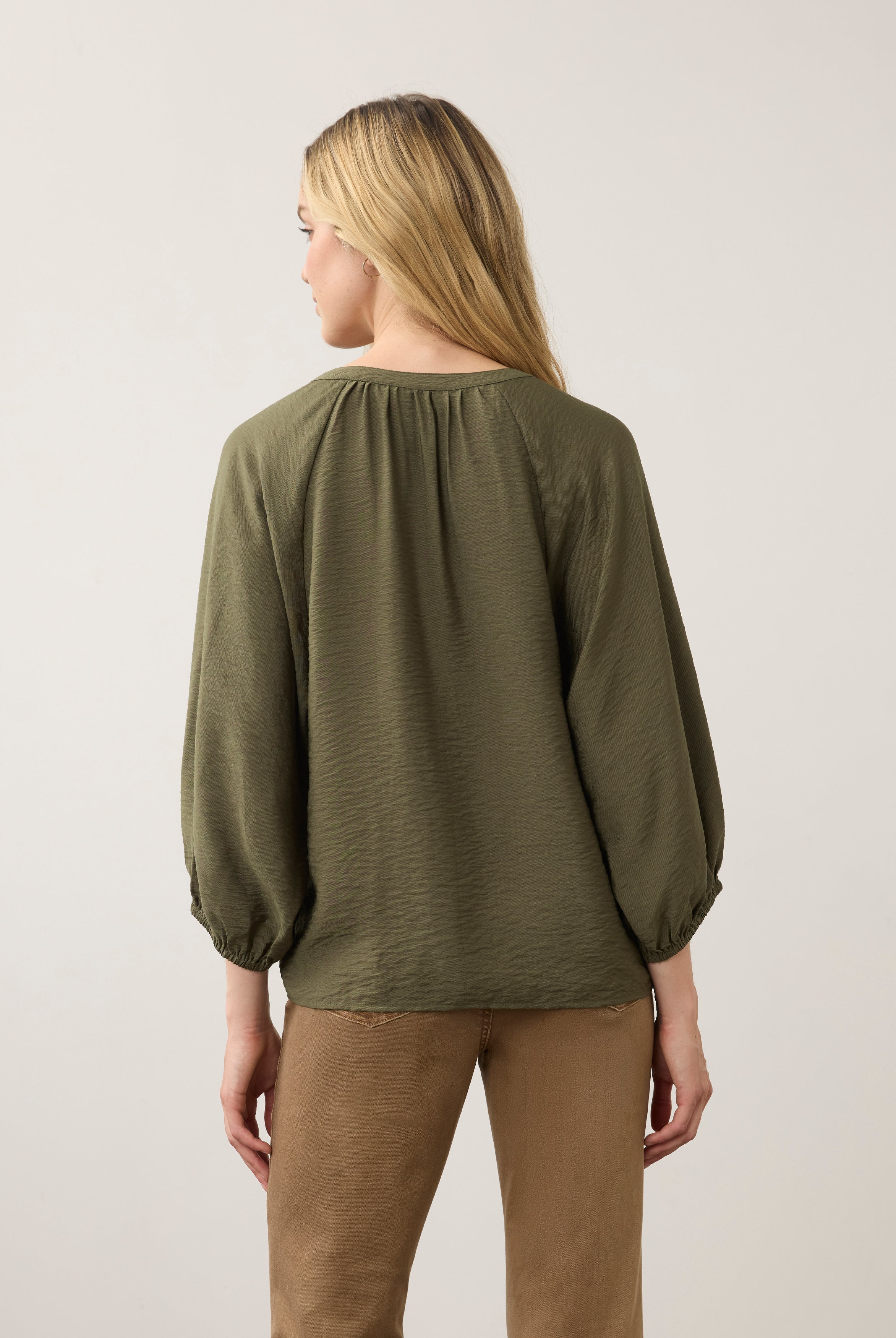 Back view of olive blouse highlighting puff sleeves by French Dressing Jeans (FDJ)