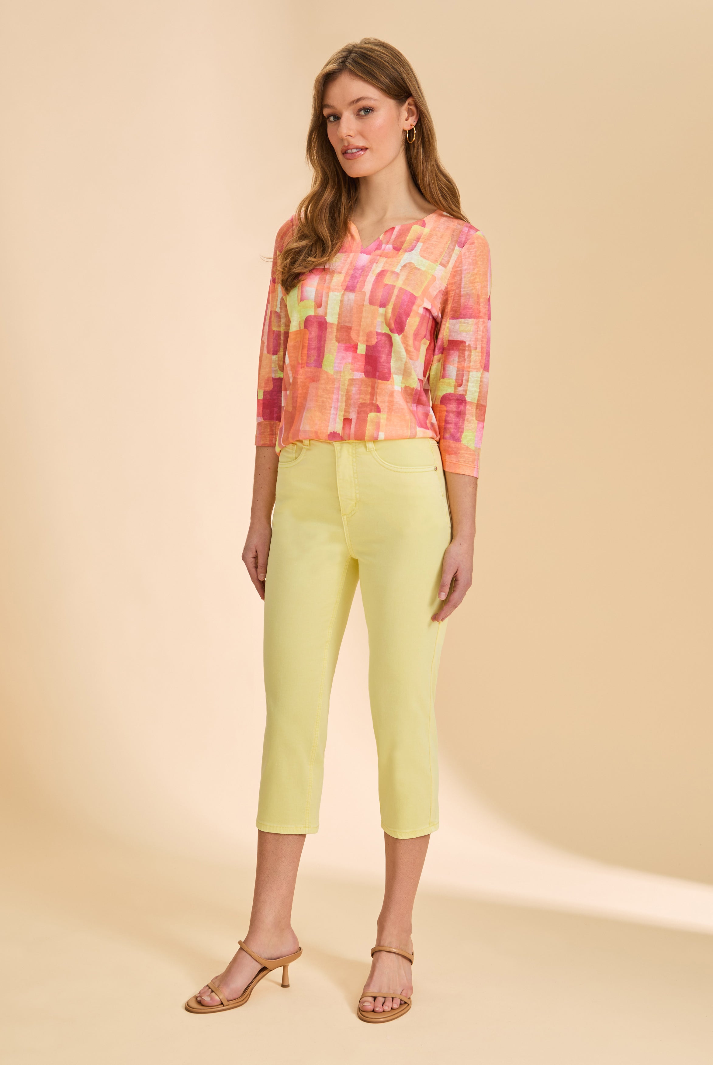 Front view of yellow cropped jeans, styled with colorful top by French Dressing Jeans (FDJ)